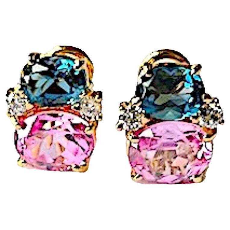 Mini 18kt Yellow gold GUM DROP™ earrings with faceted Deept Blue Topaz (approximately 2 cts each), Faceted Pink Topaz (approximately 3 cts each), and 4 diamonds weighing ~ 0.20 cts.  

Specifications: Height: 5/8