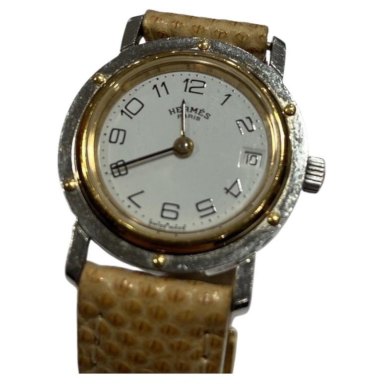 Mini montre Hermès Clipper en or et acier