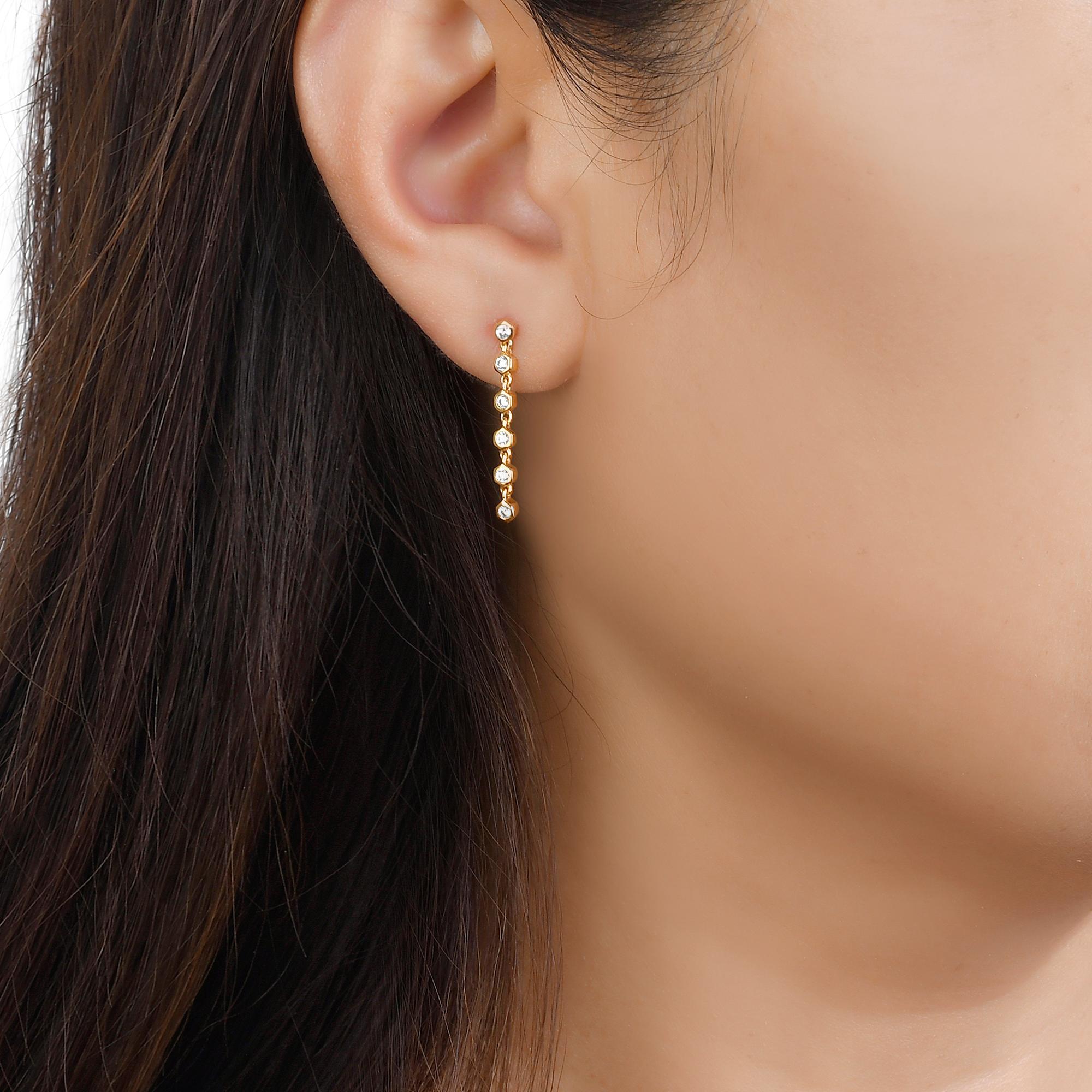 Discover the new classic in everyday fine jewelry. An updated twist to a classic piece, the Mini Honeycomb Diamond Dangling Earrings is perfect for every day wear. Elevate your essentials and add elegance to your style with this design remix of a