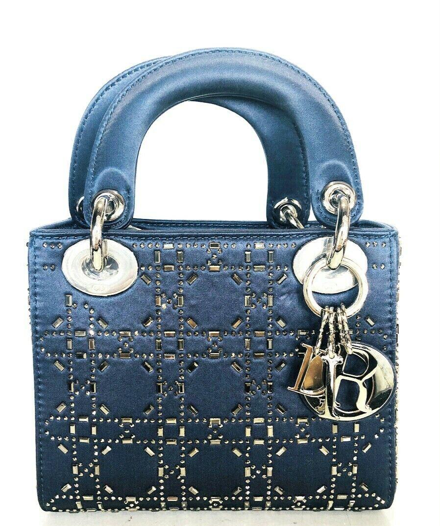 Mini Lady Dior Blue Cannage Satin w/ Rhinestones Handbag

Product details:
Blue Cannage Satin
Narrow adjustable shoulder strap
Can be carried in the hand, on the shoulder or across the body
Handle bag with silver-tone hardware
Dual flat top