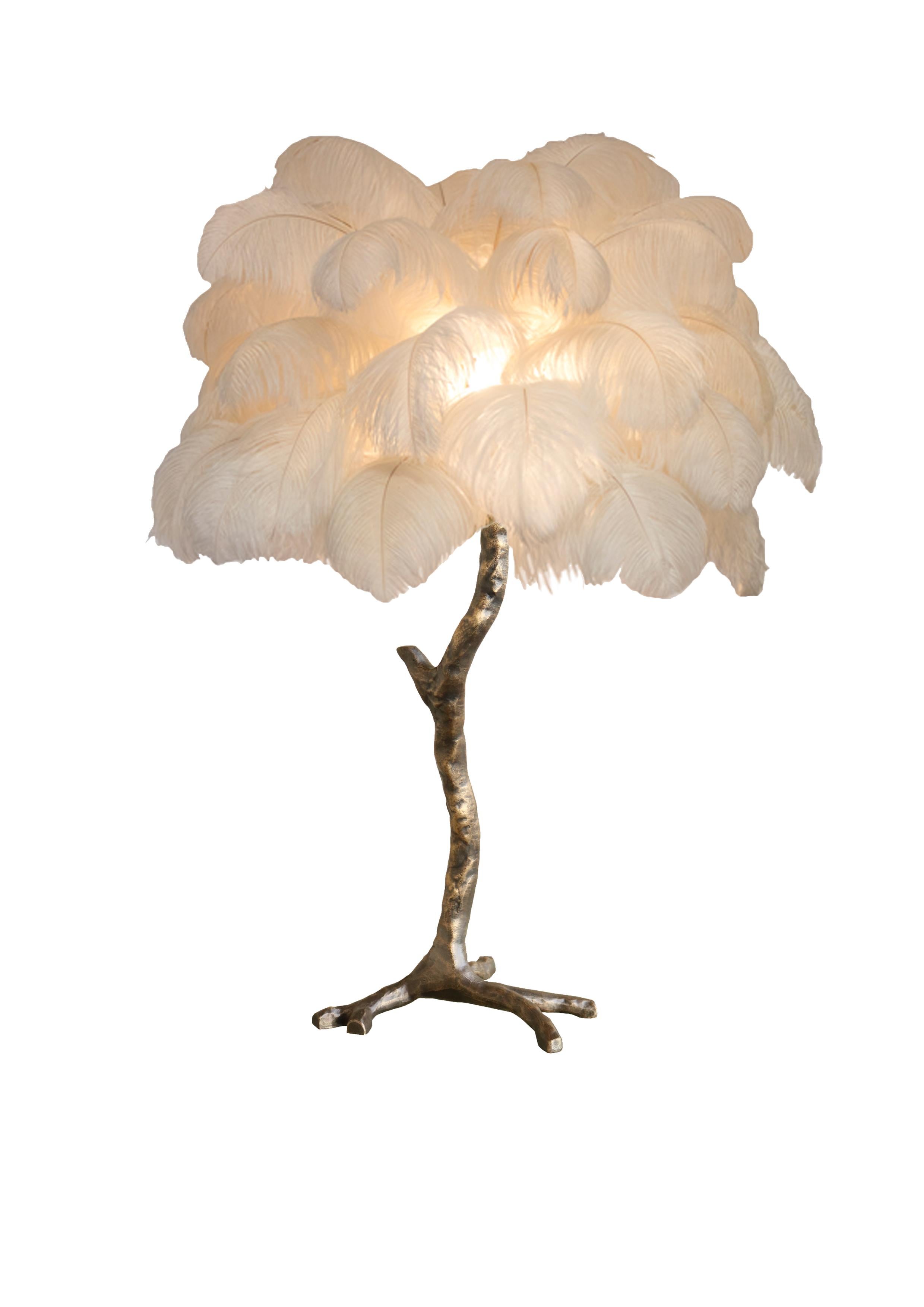 Our mini palm ostrich feather lamp is a bijoux version of the exquisite, illuminating ostrich feather floor lamp. Each piece delivers a glorious luxurious statement to any design or styling project - perfect in Pairs! Handmade in our Oxfordshire