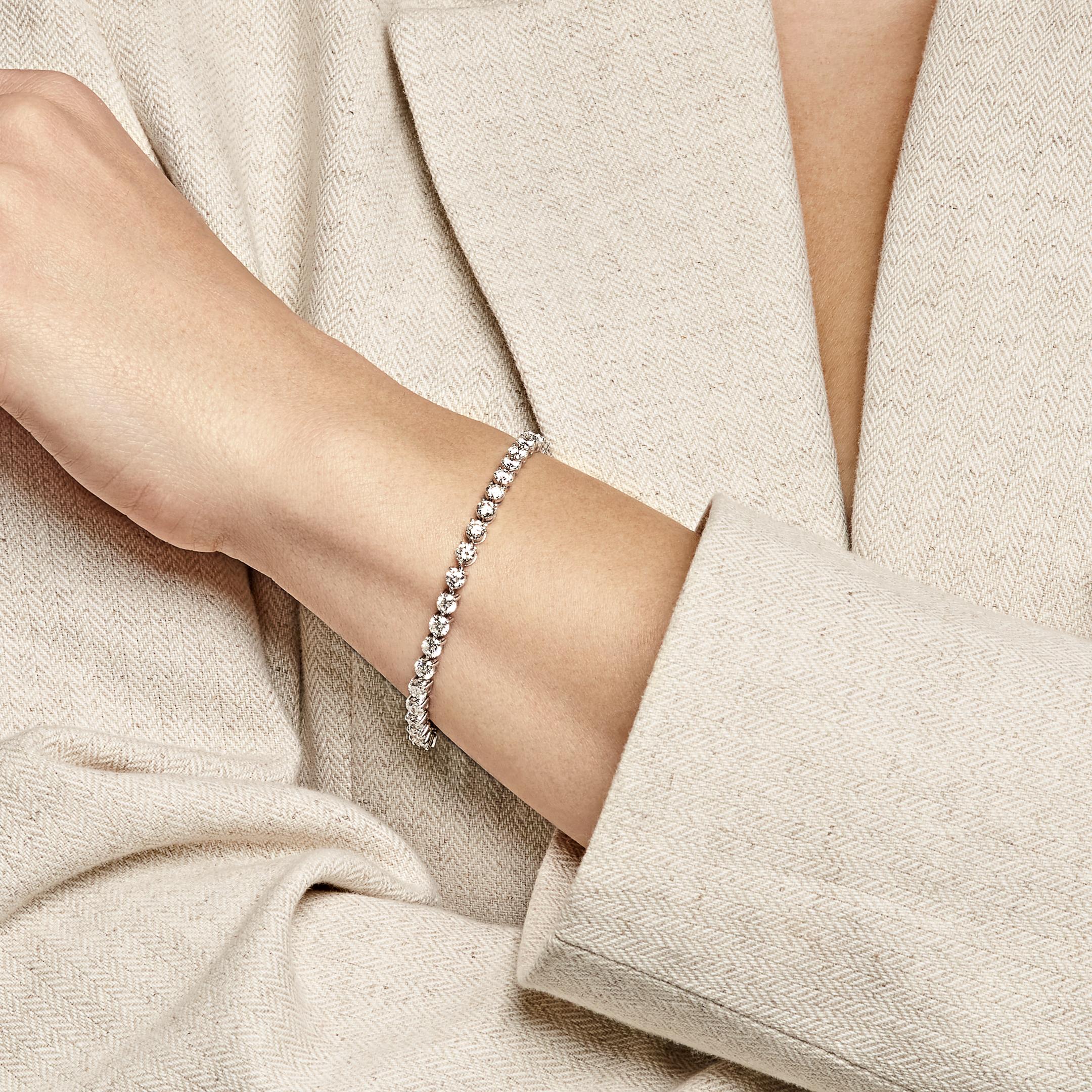 Jewels Aficionado offers this timeless take on effortless elegance, this diamond tennis bracelet is crafted in 18K white gold and set with 36 round diamonds totaling 5.57 carats. The three-prong setting of the diamond bracelet, enhances each stone’s