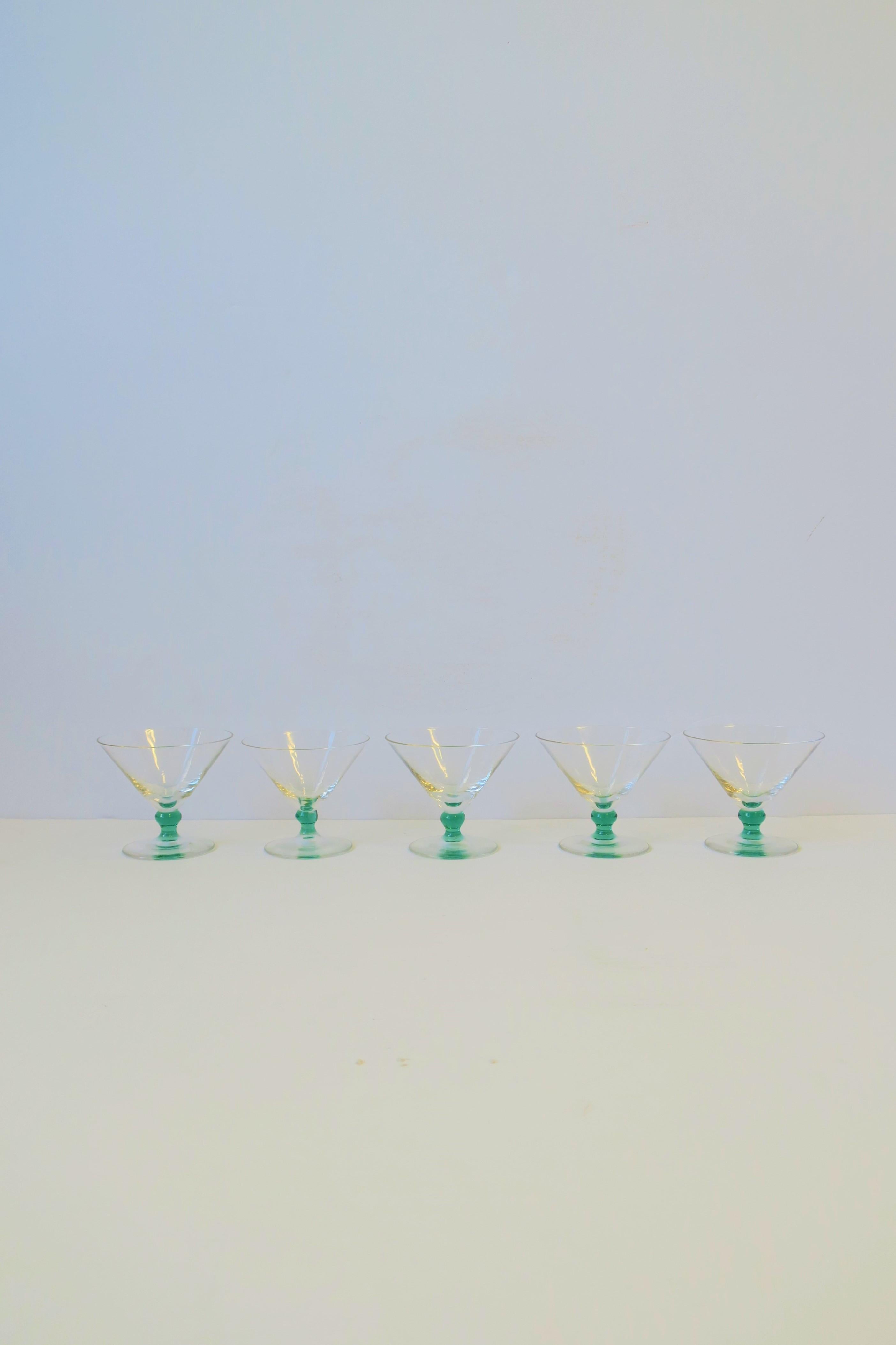A beautiful set of 5 mini Martini art glass shot glasses with a touch of emerald green art glass at stem. A great set for summer or holiday entertaining. And a great addition to any bar, bar cart, tray, etc. Each glass measures: 2.50