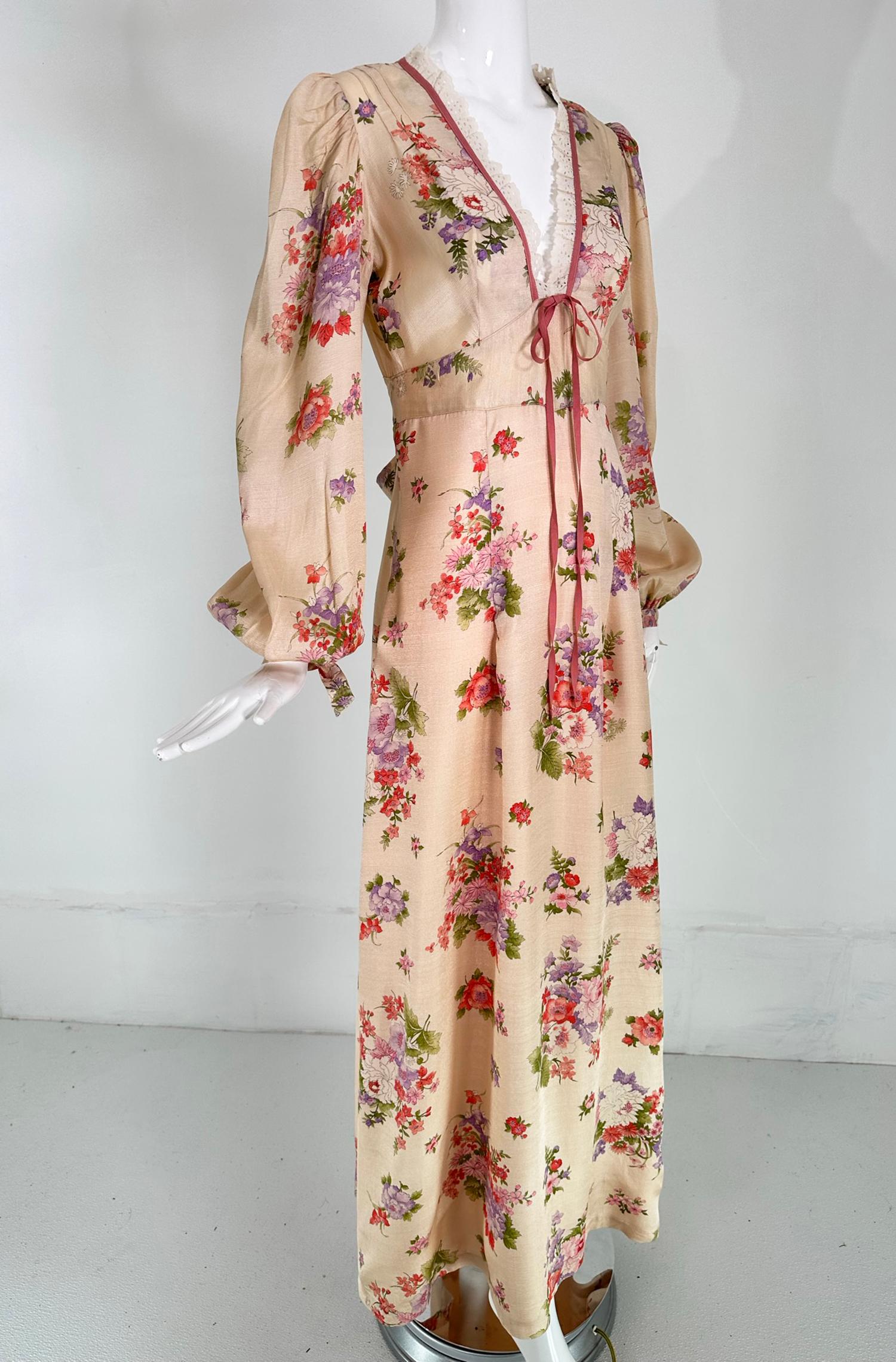 Mini Max of California floral print, bohemian style bishop sleeve maxi dress, retailed at I Magnin. Soft peachy pink ground with pastel flower bouquets scattered across the dress. A very sweet dress with eyelet trimmed neckline in a low V at the