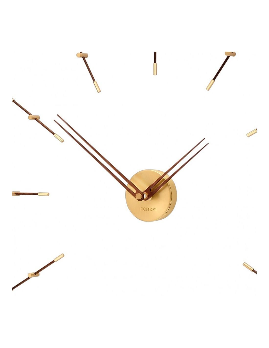 The Merlin mini 12 Gold N stands out among all modern wall clocks thanks to its walnut needles reinforced with golden counterweights to which we must add its 12 elegant time points with a beautiful polished brass and wood finish with walnut.
Mini