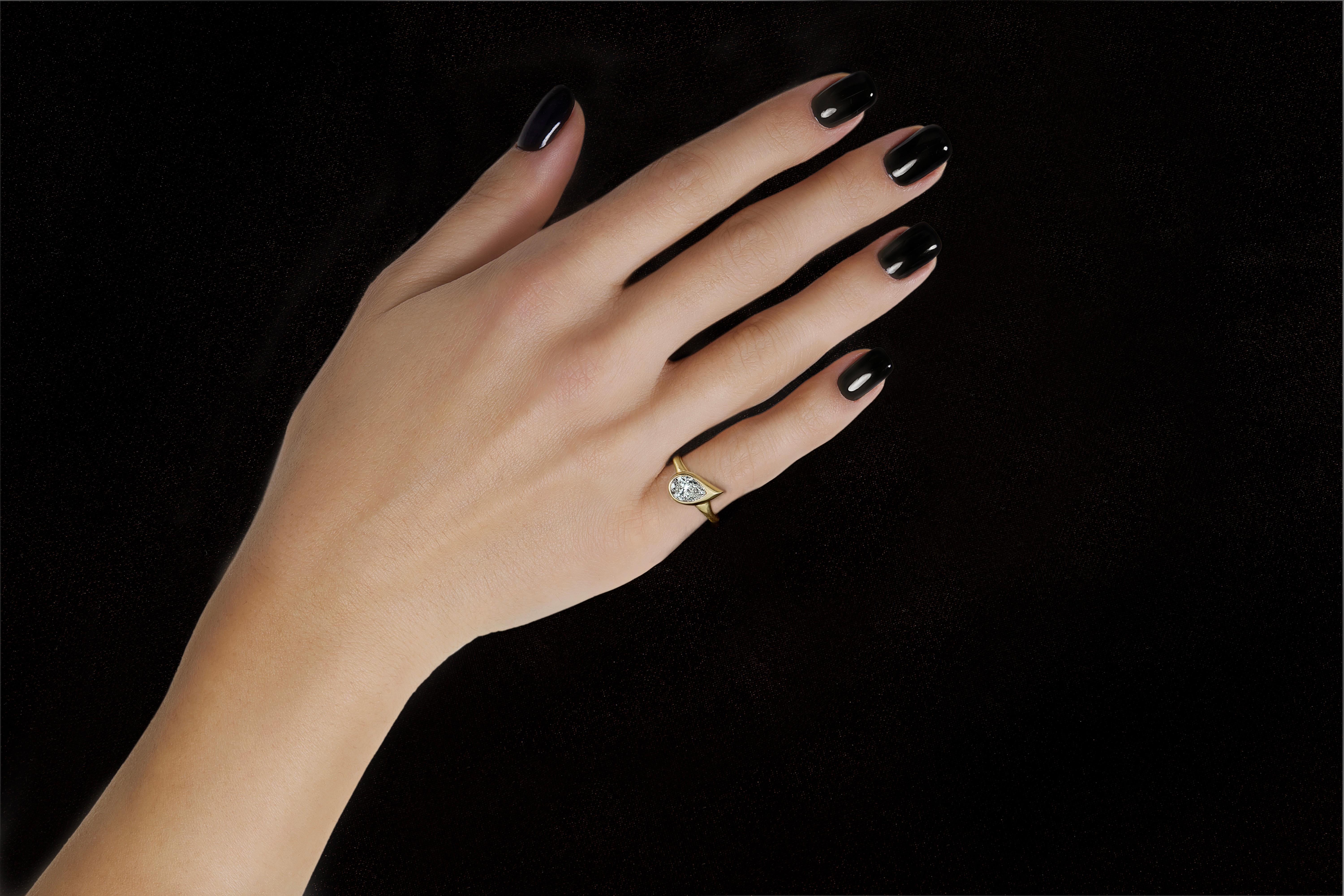 In the world of fine jewelry, the pinky ring reigns supreme. Everyone needs an excuse to raise their glass, and this exceptional bezel-set diamond pinky ring delivers. Inspired by elements of the earth, The Mini Mika Pinky Ring features a sleek
