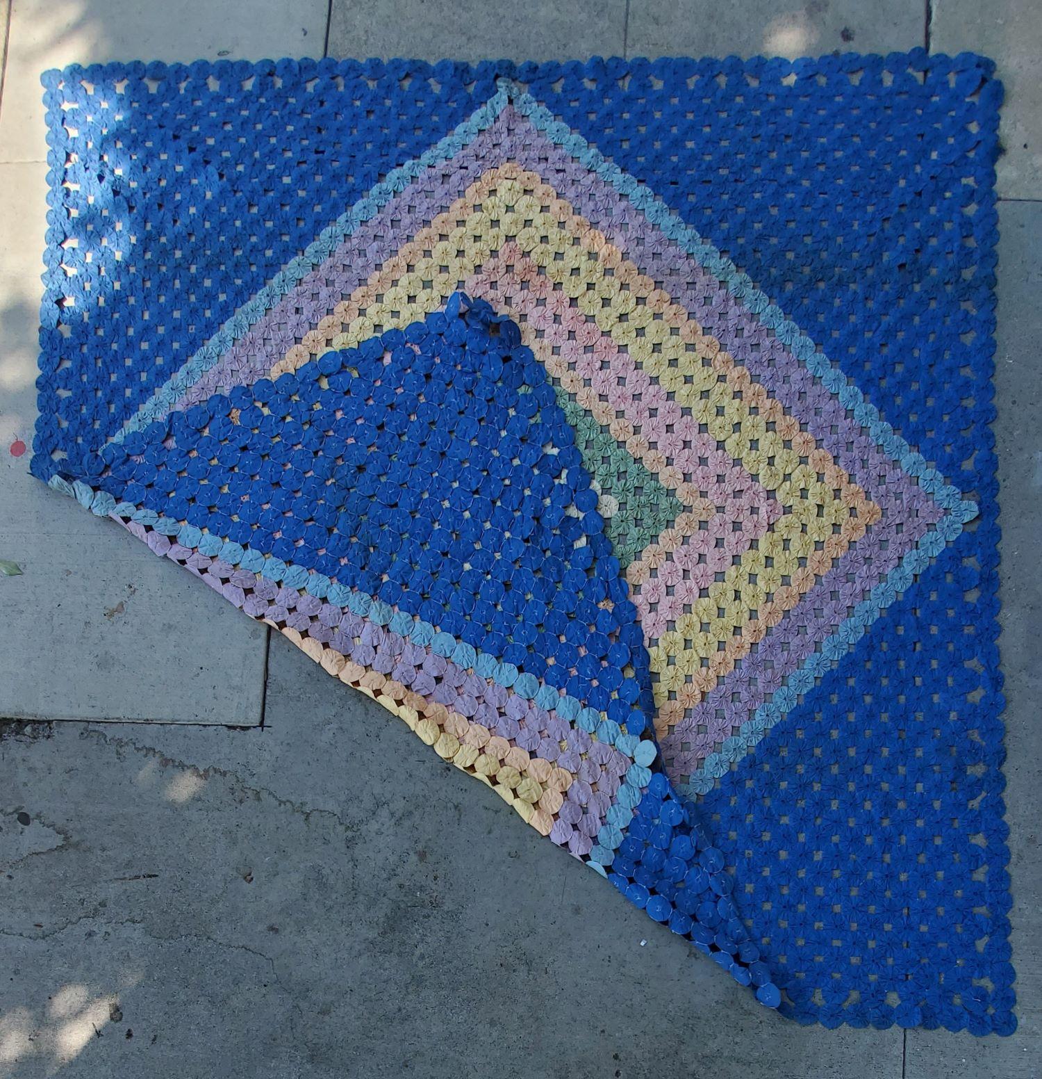 This mini pieced diamond in a square yoyo quilt. The condition is very good and it is a large quilt.