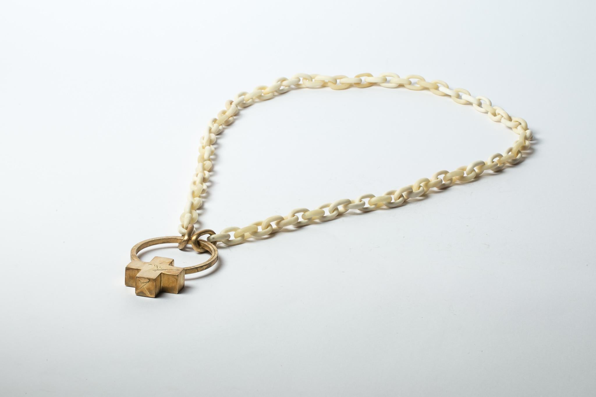 All organic chain is carved by hand. Chains made from bone are modeled and constructed into chain links. Brass substrate is electroplated with 18k gold and then dipped into acid to create the subtly destroyed surface.
The Charm System is an