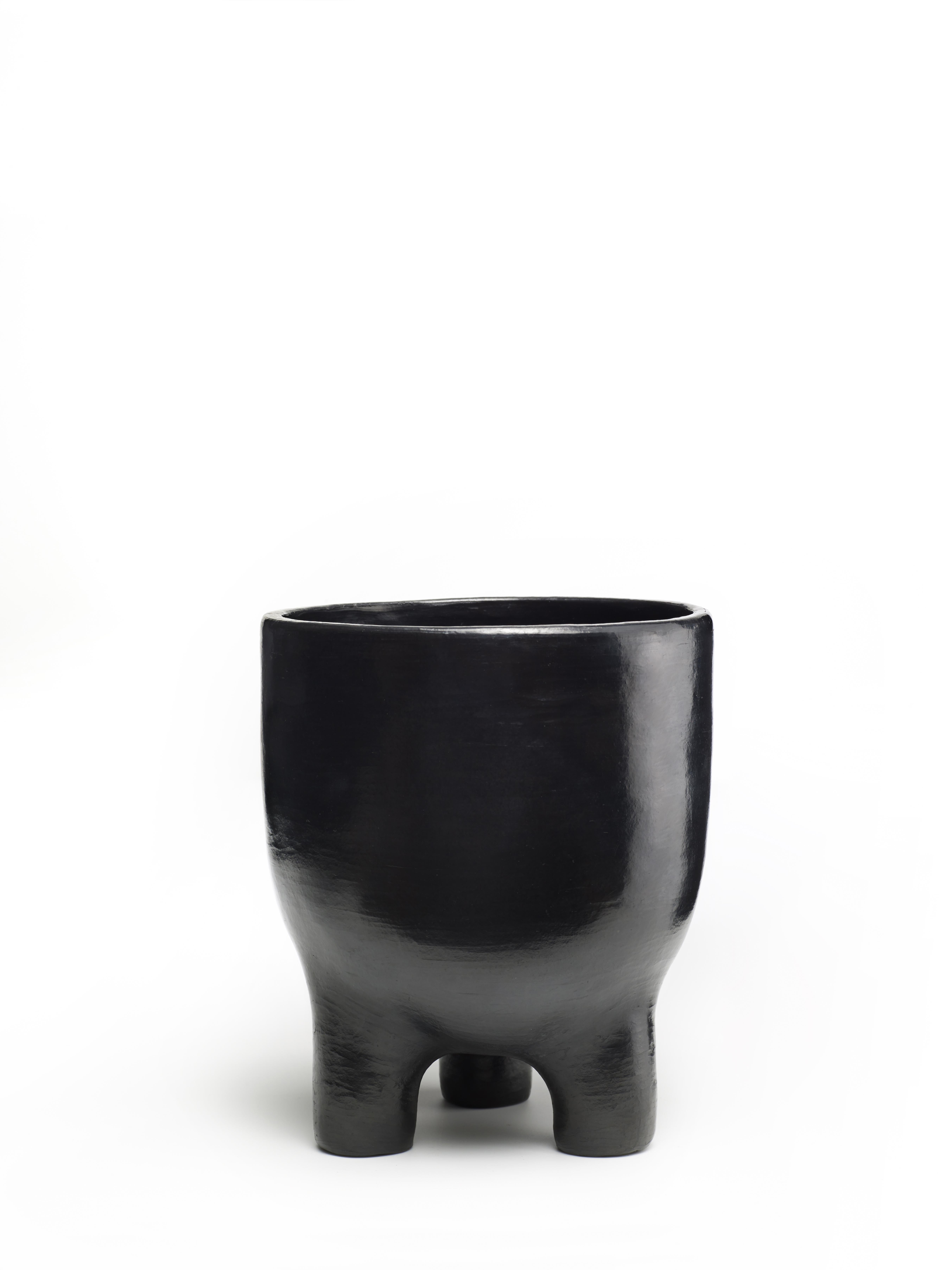 Mini Pot 2 by Sebastian Herkner
Materials: Heat-resistant black ceramic. 
Technique: Glazed. Oven cooked and polished with semi-precious stones. 
Dimensions: Diameter 17 cm x H 20 cm 
Available in sizes Large and Small. 

This pot belongs to
