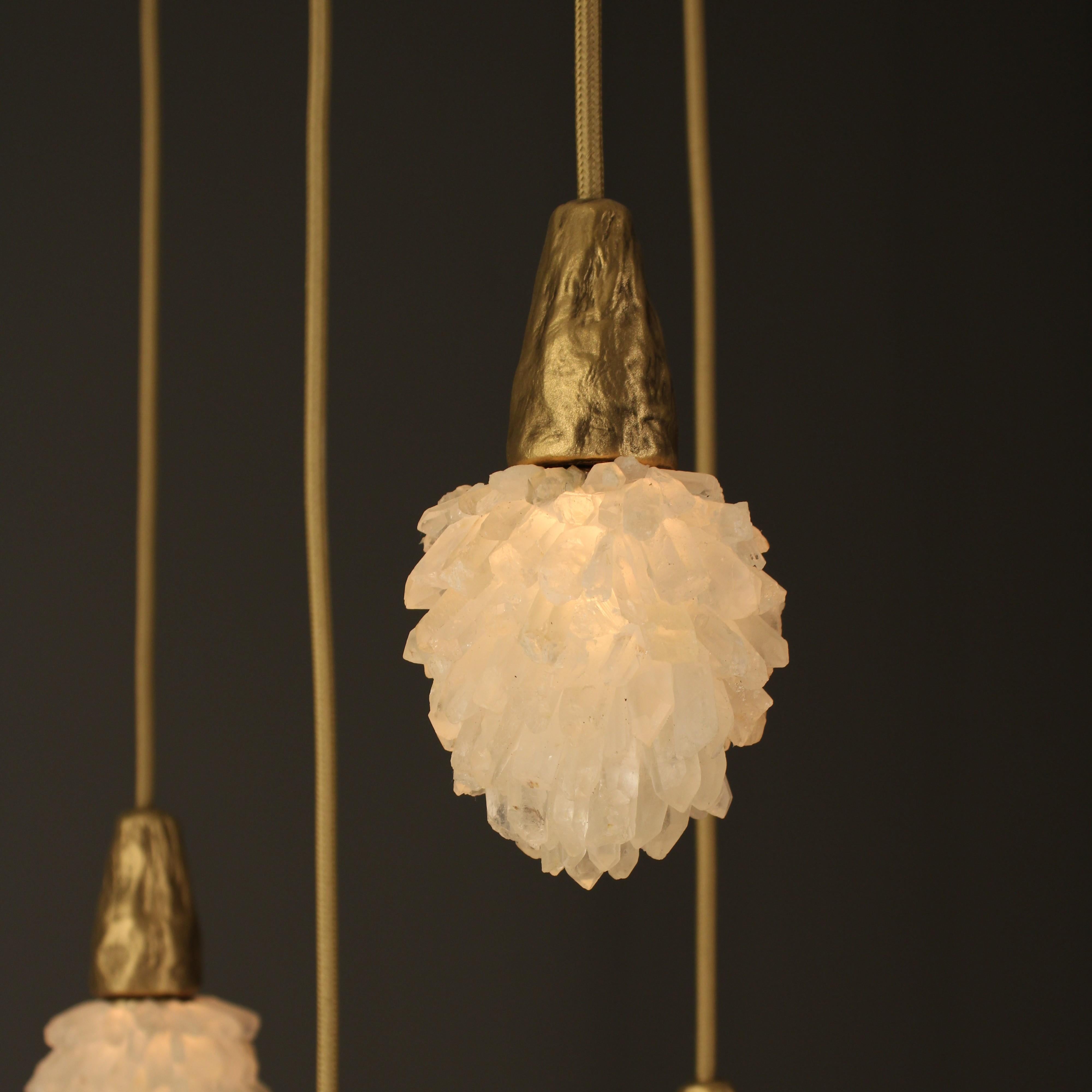 Mini Quartz Drop Lamp by Aver
Dimensions: D 8 x H 16 cm
Materials: White quartz, ceramic, metal.

A series of lamps molded in a lively, imperfect, and organic ceramic texture, in contrast to the slender and objective silhouette of its structure. Its