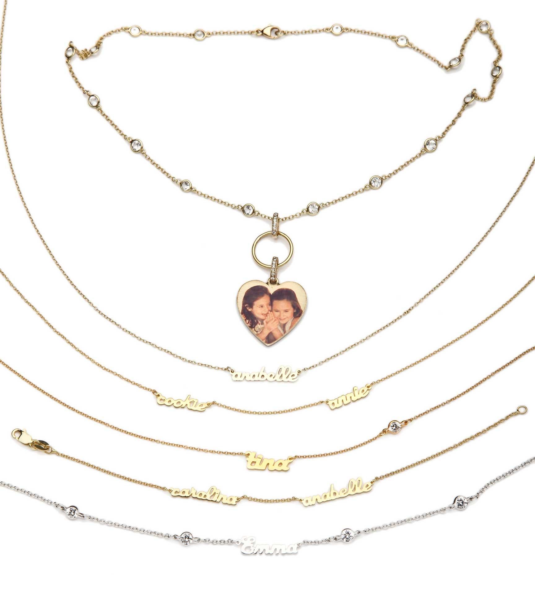 Personalized Mini Script Name Necklace shown and priced with One Name  in Yellow Gold Plate.

The Mini Script collection can be made in Stering silver, Gold plate or 14kt gold.
You may add as many names as you like.

The Mini Script Personalized