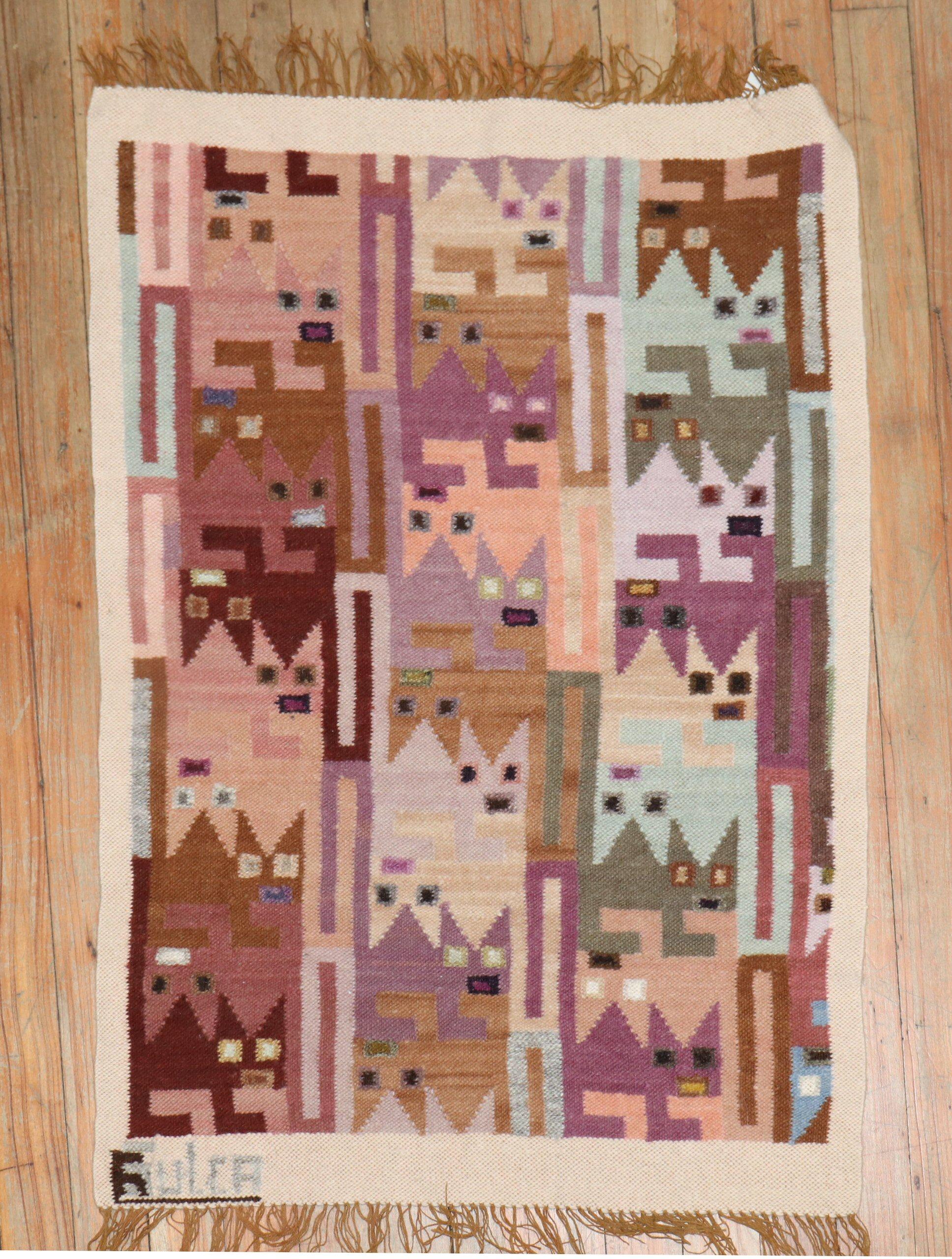 Mini size signed swedish kilim with a design consisting of a flurry of kittens

Measures: 1'11