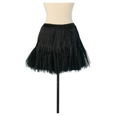 Mini jupe plissée en soie avec bord en dentelle ALEXANDRE VAUTHIER COUTURE