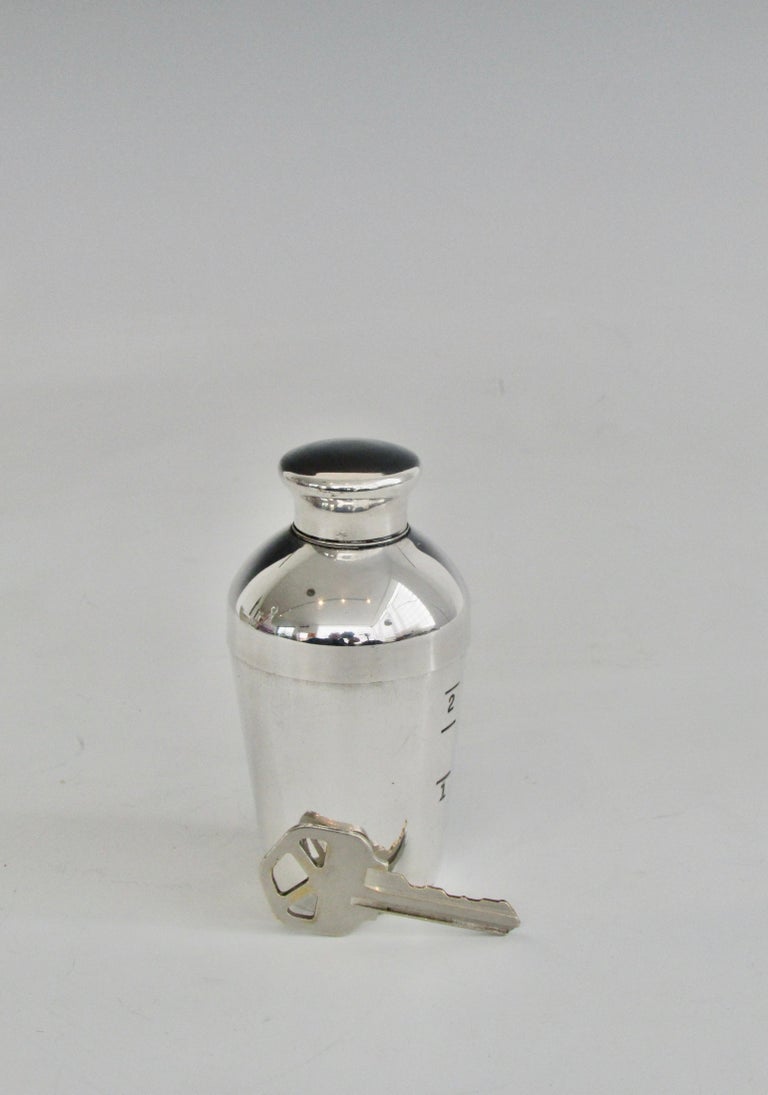 Diminutive 2 ounce cocktail shaker in silver plate. Stamped Napier.