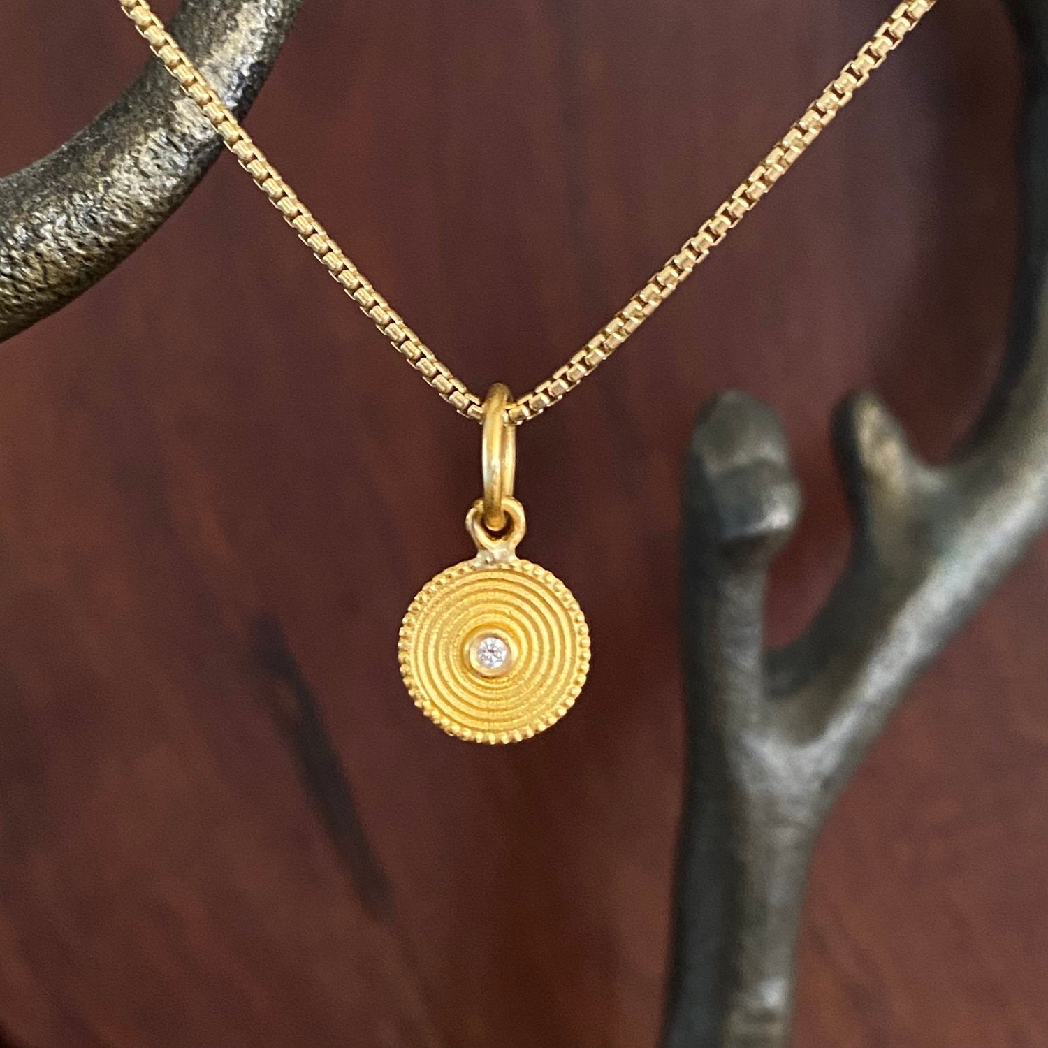Mini Spiral, Rhythm of Life, Charm Pendant, 24K with Diamond, Handmade, by Prehistoric Works of Istanbul, Turkey
What does the spiral symbol mean? The spiral is one of the oldest symbols in the world. It appears in most ancient cultures across the