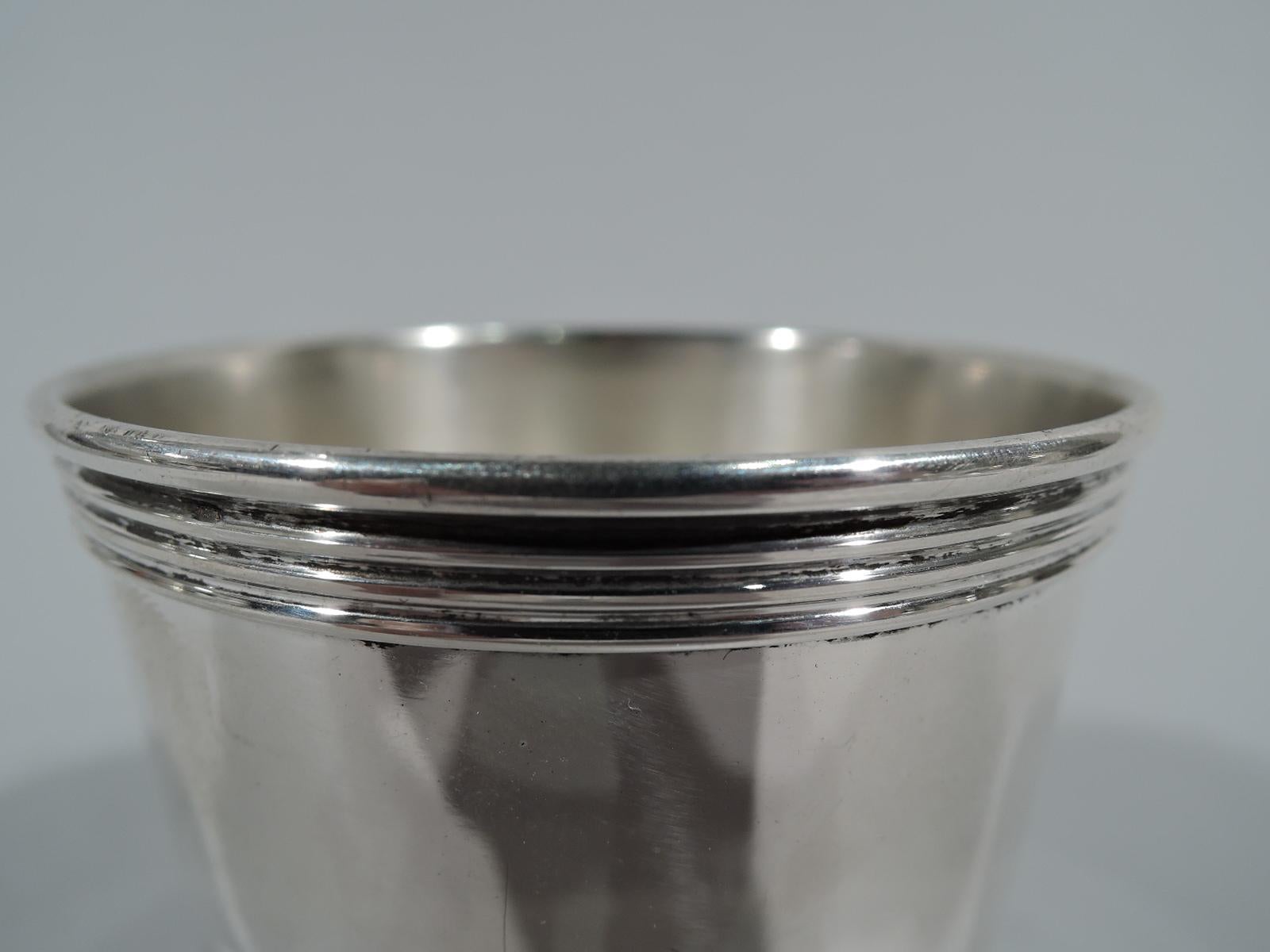 Mini sterling silver mint julep. Traditional form in reduced scale with straight and tapering sides and reeded rim and foot. A great training cup for a junior tippler. Fully marked including stamp for Trees, which was active in Lexington, Kentucky