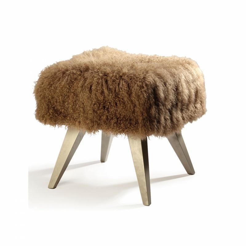 Mini stool gathers inspiration from Scandinavian design made incredibly confortable with the addition of soft upholstery. The top is upholstered in natural sheep leather and the legs are made of solid wood. Made to Order. 

