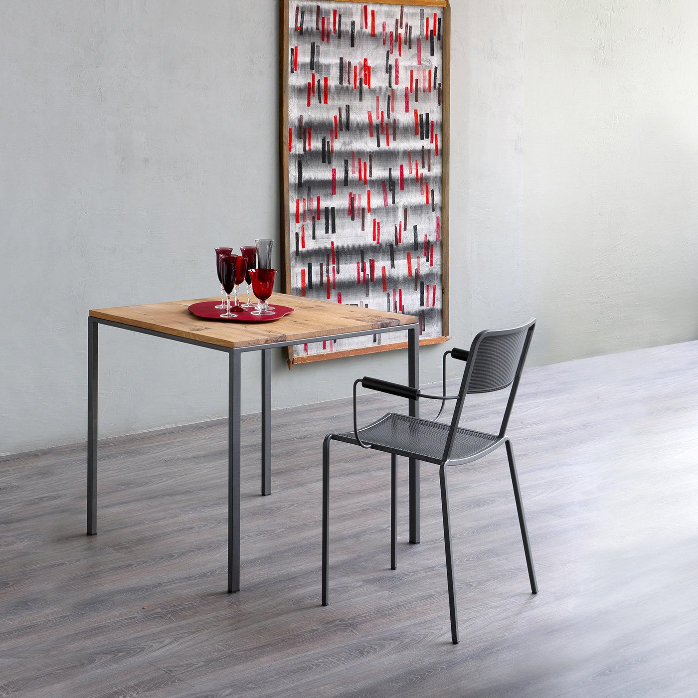 Crafted using modern materials and finishes, the Mini Tavolo Side Table rests on a textured powder-coated metal base and topped in high pressure laminate with a cool rust finish. Giving off a decidedly industrial look and feel, the side table