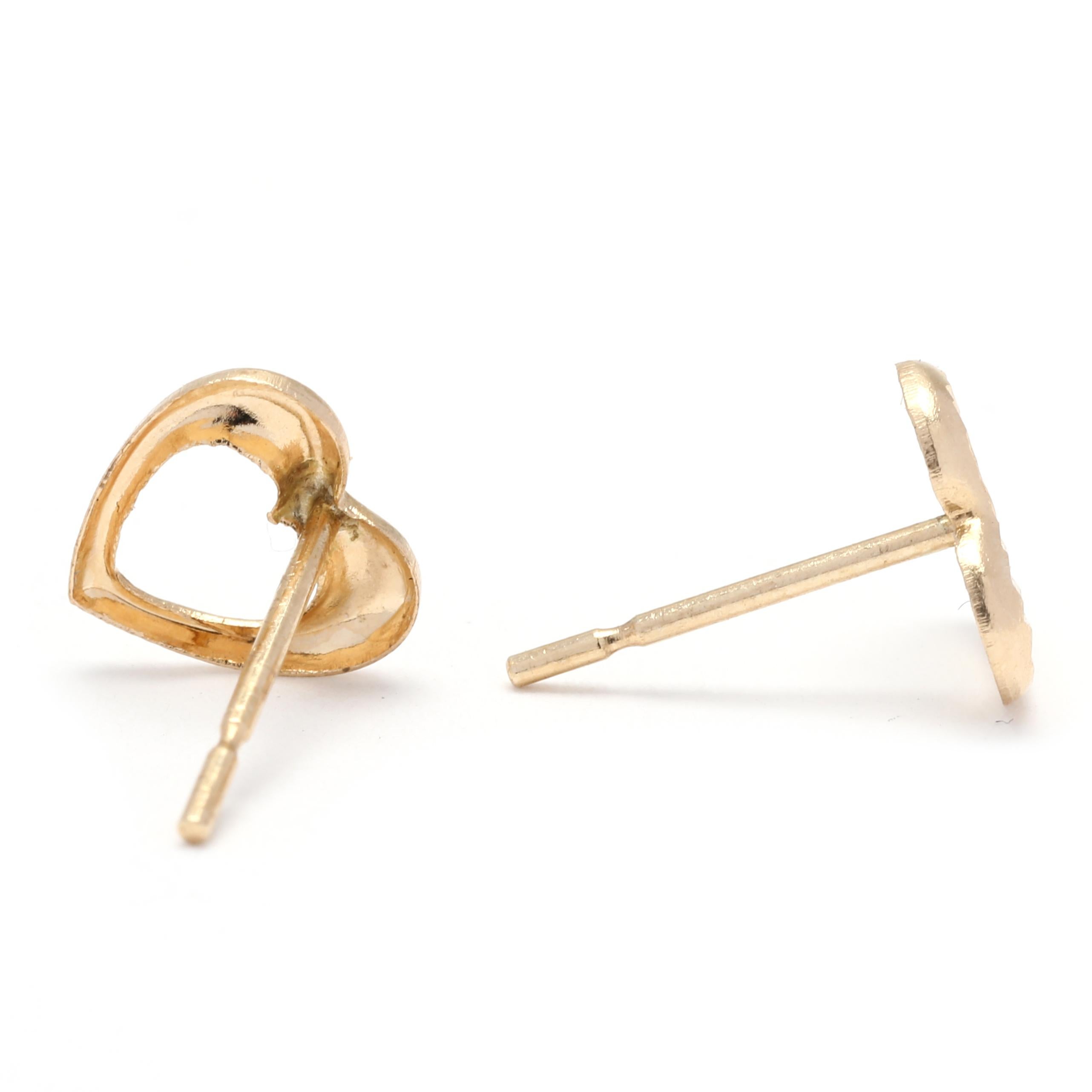 These adorable Mini Textured Heart Stud Earrings are the perfect addition to any jewelry collection. Made from 14K yellow gold, these small gold heart earrings are both elegant and versatile. With a length of just 1/4 inch, they are subtle and