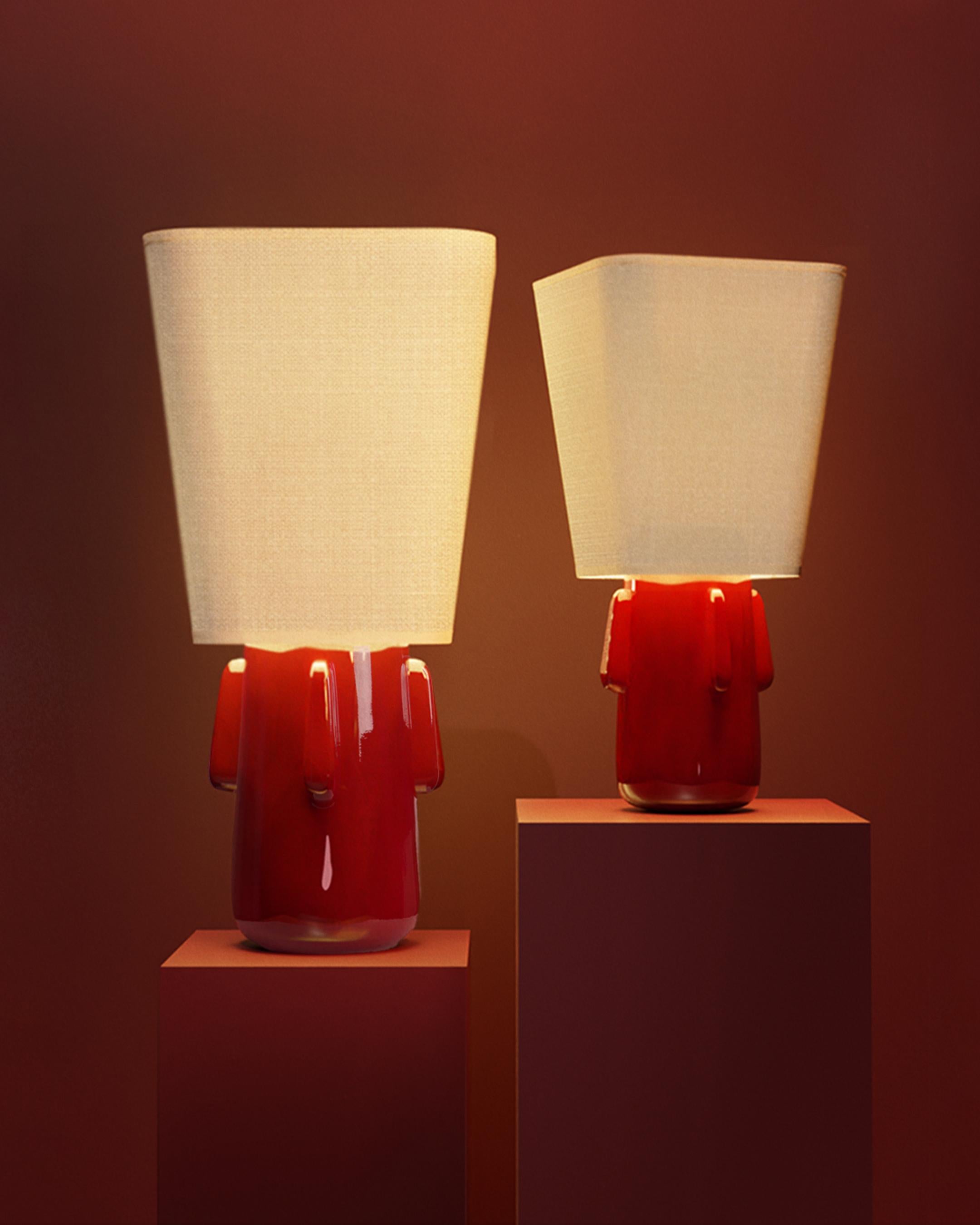 Mini Toshi Table Lamp by Kira Design
Dimensions: ⌀ 28 x H 55 cm
Materials: Ceramic, Linen.
Available Blue, Red, Green, Black, Yellow

The MINI TOSHI table lamp is the little sister of our iconic Toshiro lamp. 

With its size of 55cm and diameter of