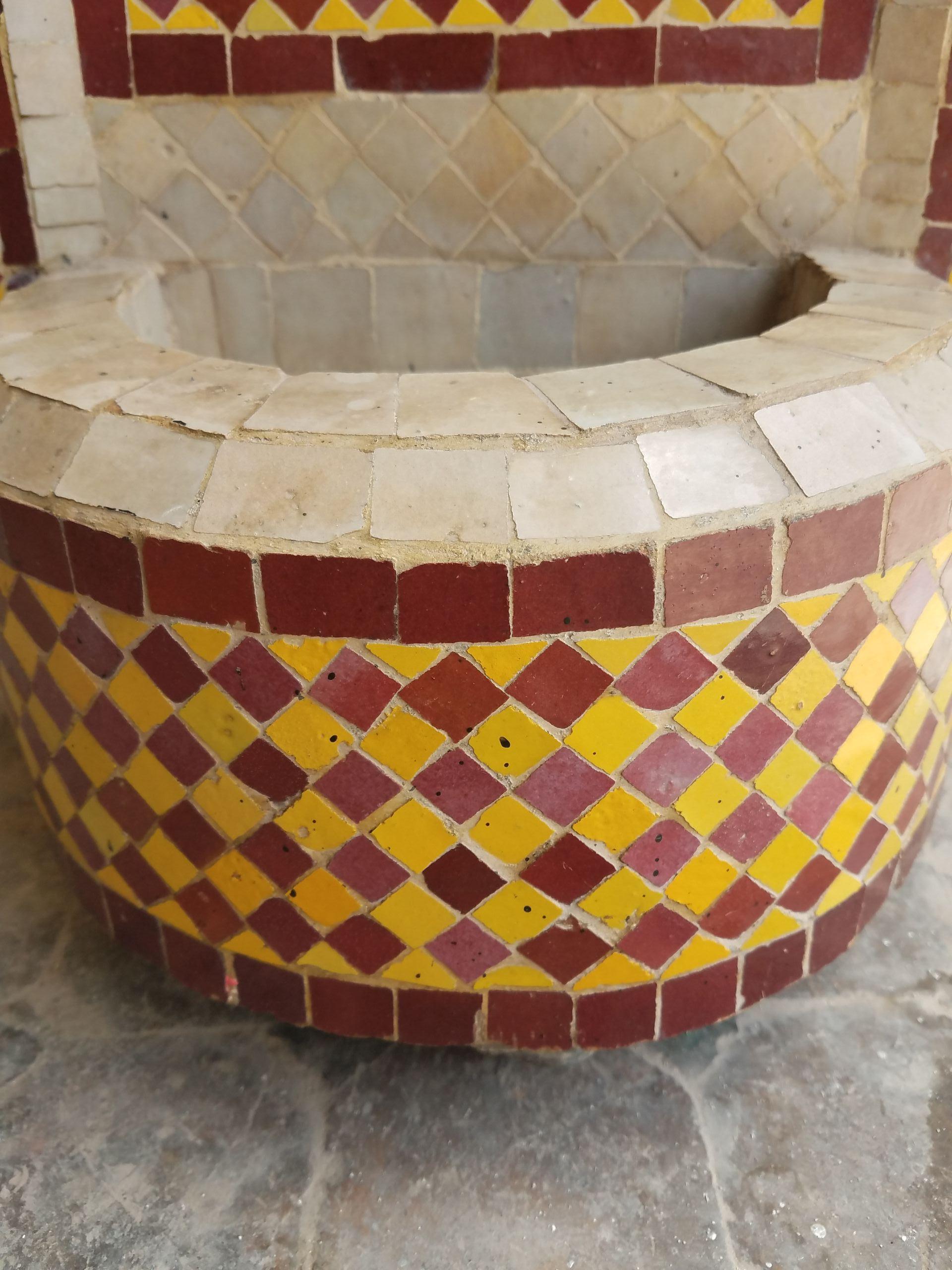 Mini Moroccan mosaic fountain handmade in Marrakech, Morocco. Colors are burgundy / yellow / beige. This type of fountain is usually found in courtyards and Riads all-over Morocco. Measuring approximately 29