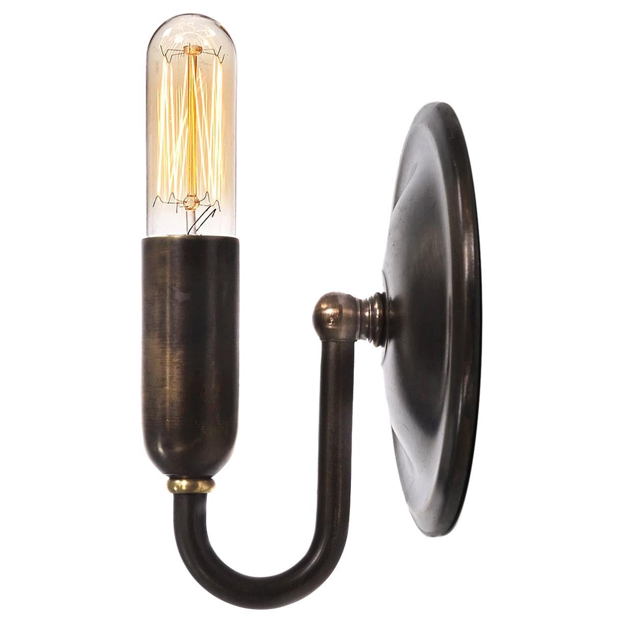 This is a very clean and simple pill shaped lamp. The lamp is half brass. The look goes well with all styles. The lamp housing and bulb has a 1 inch diameter and is 5 inches long.