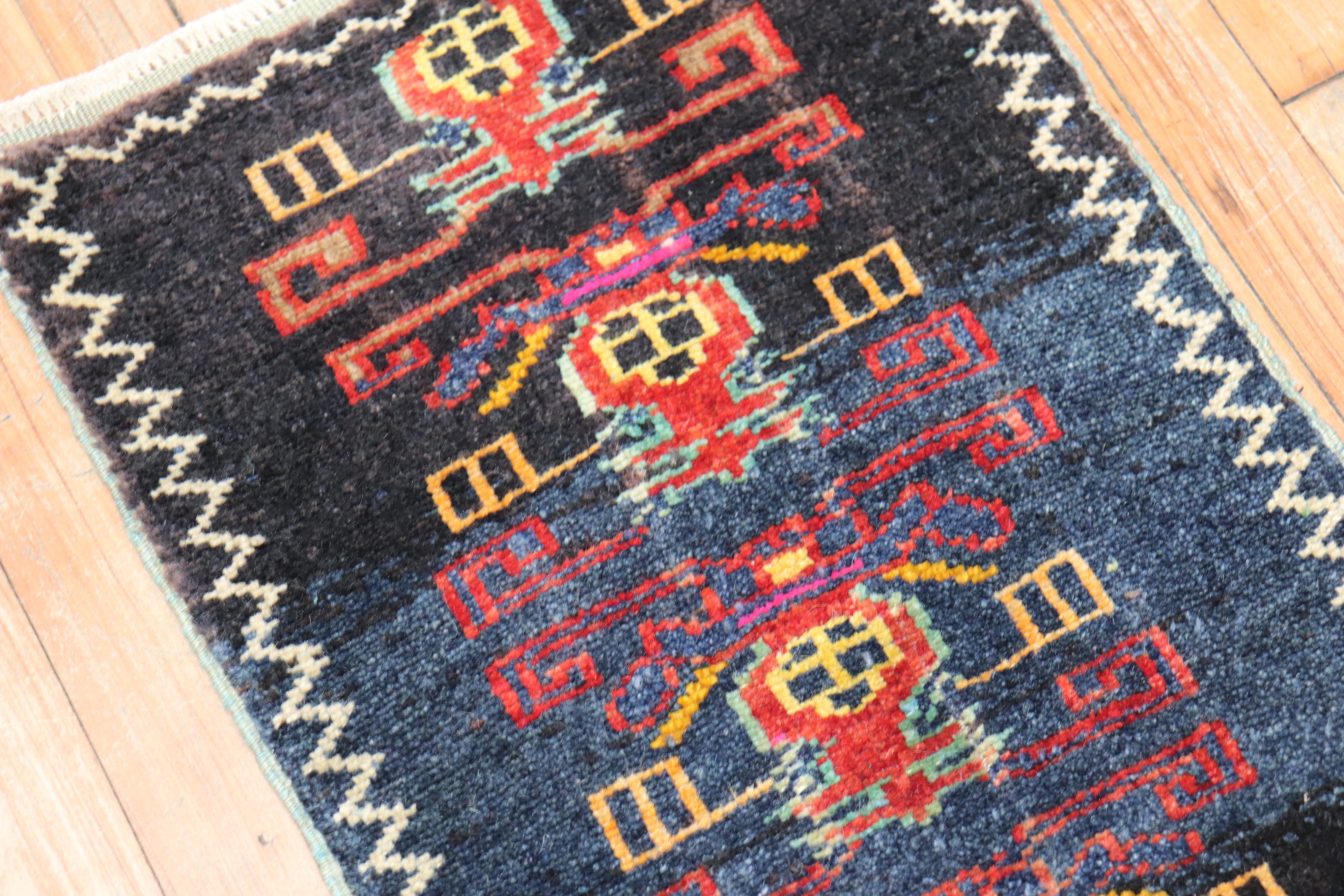 A mini size Turkish rug from the third quarter of the 20th century

Measures: 1'6” x 2'8