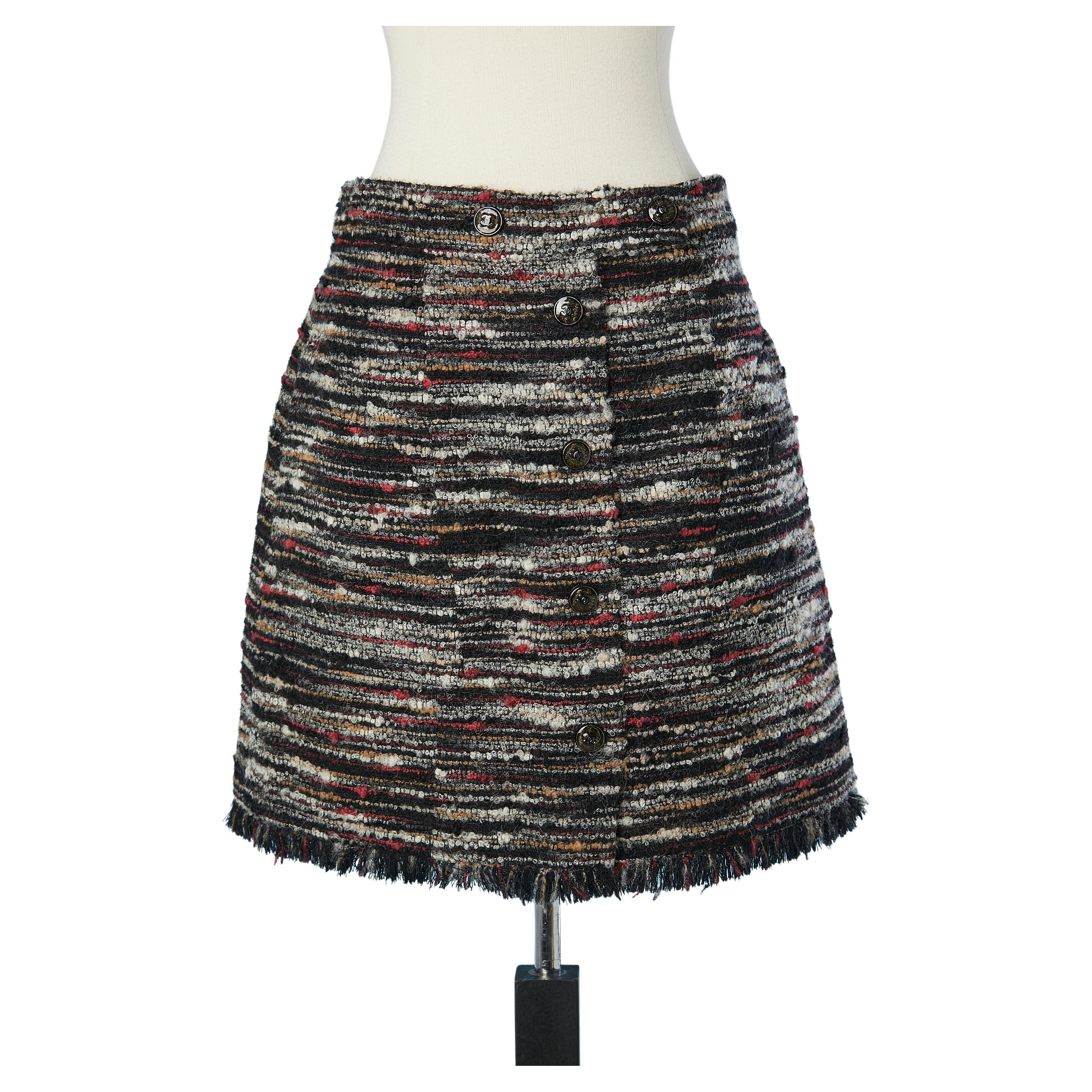 Mini tweed skirt with branded buttons on the front Chanel  For Sale