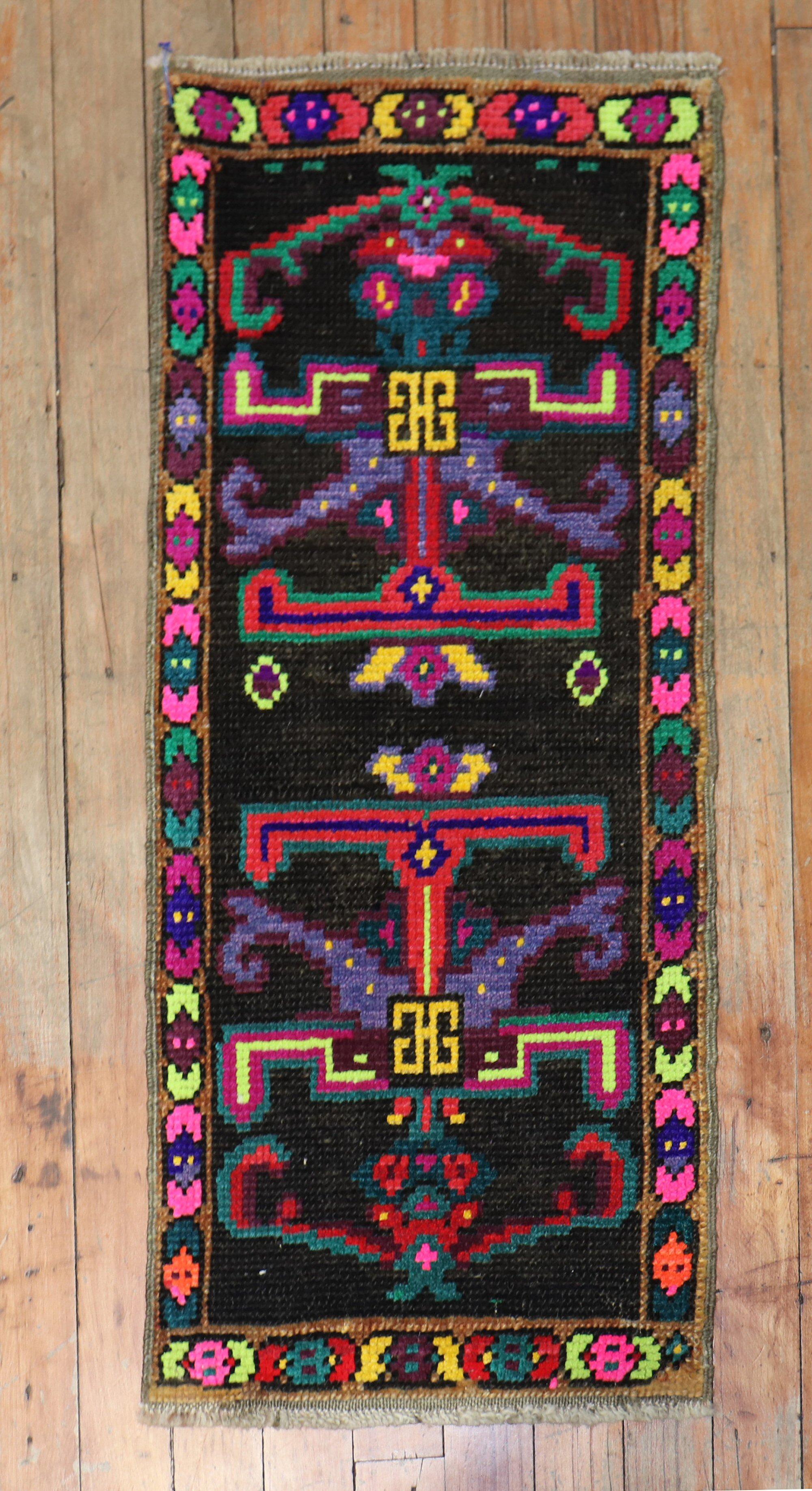 A vintage Anatolian Turkish Mini size colorful rug from the 3rd quarter of the 20th century

1'2'' x 2'9''