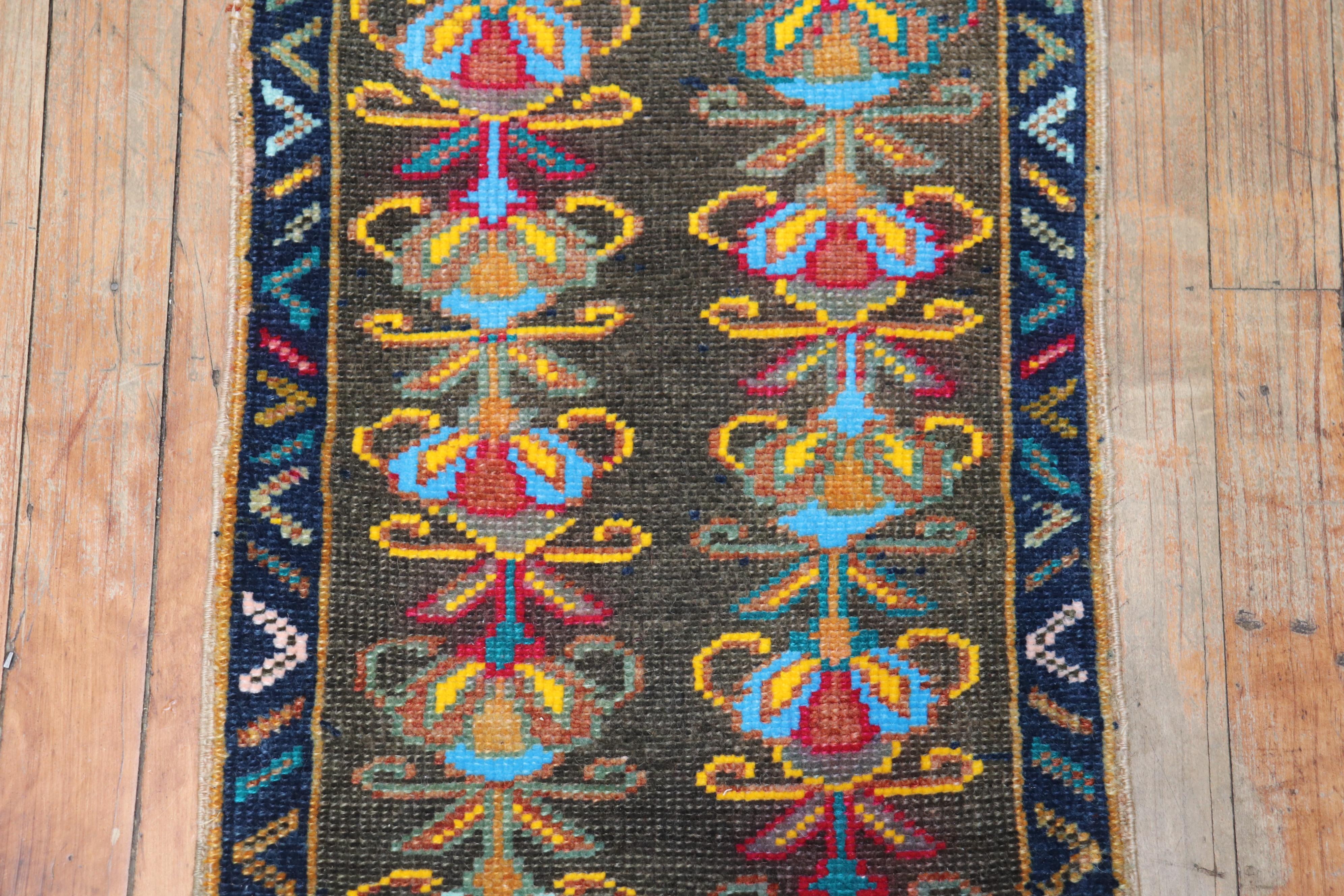 A vintage Anatolian Turkish mini-size colorful rug from the 3rd quarter of the 20th century

1'4'' x 2'11''