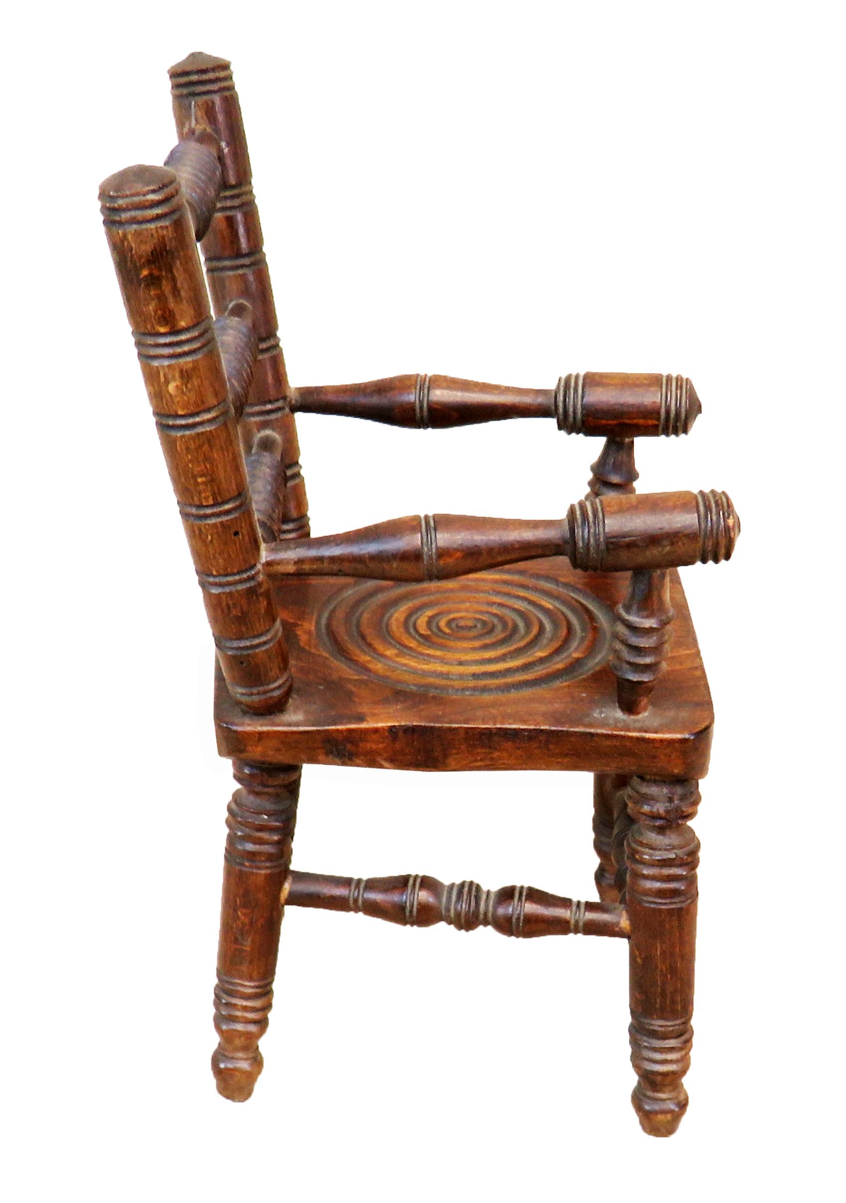 A delightful late 19th century miniature oak
kitchen Windsor armchair having attractive
turned decoration to back, seat, legs
and supports

(A most unusual and charming item of Miniature
furniture this Windsor Armchair is of