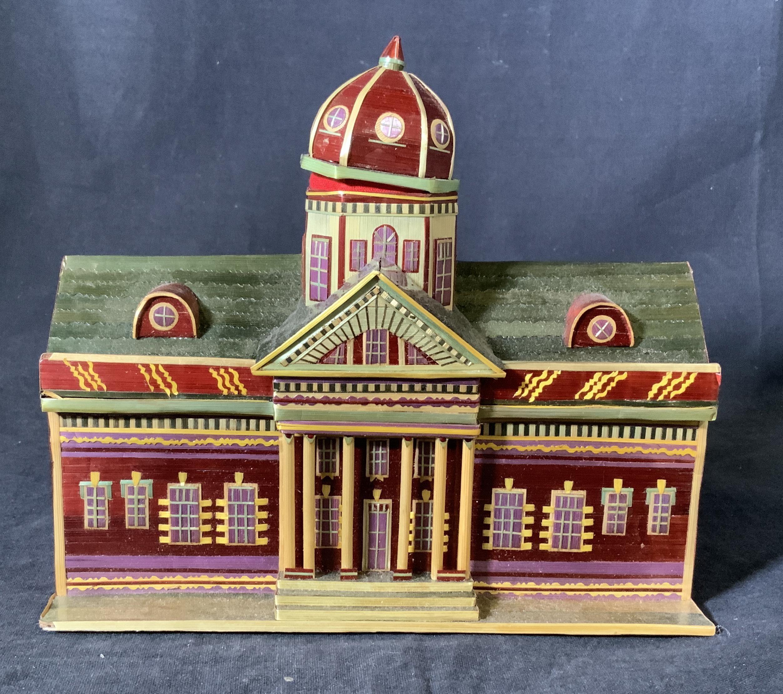 Petite house shaped stacking box made of multicolored painted wood, measures: 7 inches tall x 7 7/8 inches, top piece, the capital, is removable for storage, then opens up to a rectangular open area for additional storage. Will make a wonderful