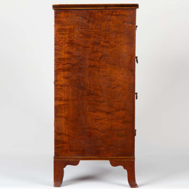 An exceptional specimen, this well preserved work was likely crafted as a salesman's sample to assist in selling larger forms of the same chest. It was crafted with utmost care and attention to detail, allowing potential customers to see exactly