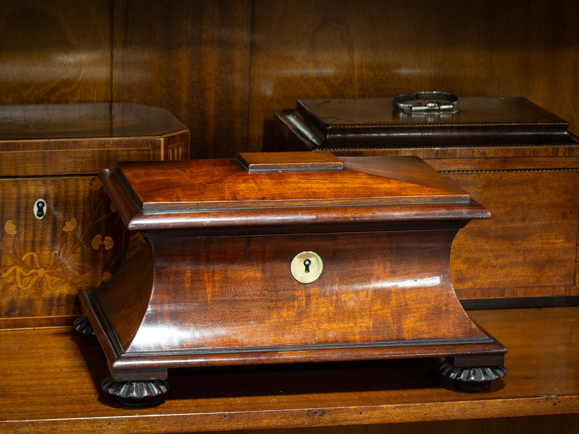 Circa 1835

From our Tea Caddy collection, we are pleased to offer this late Miniature Salesman Sample Georgian Sarcophagus Mahogany Tea Caddy. The Tea Caddy shaped in sarcophagus form made from Mahogany with a raised convex lid and gently tapered