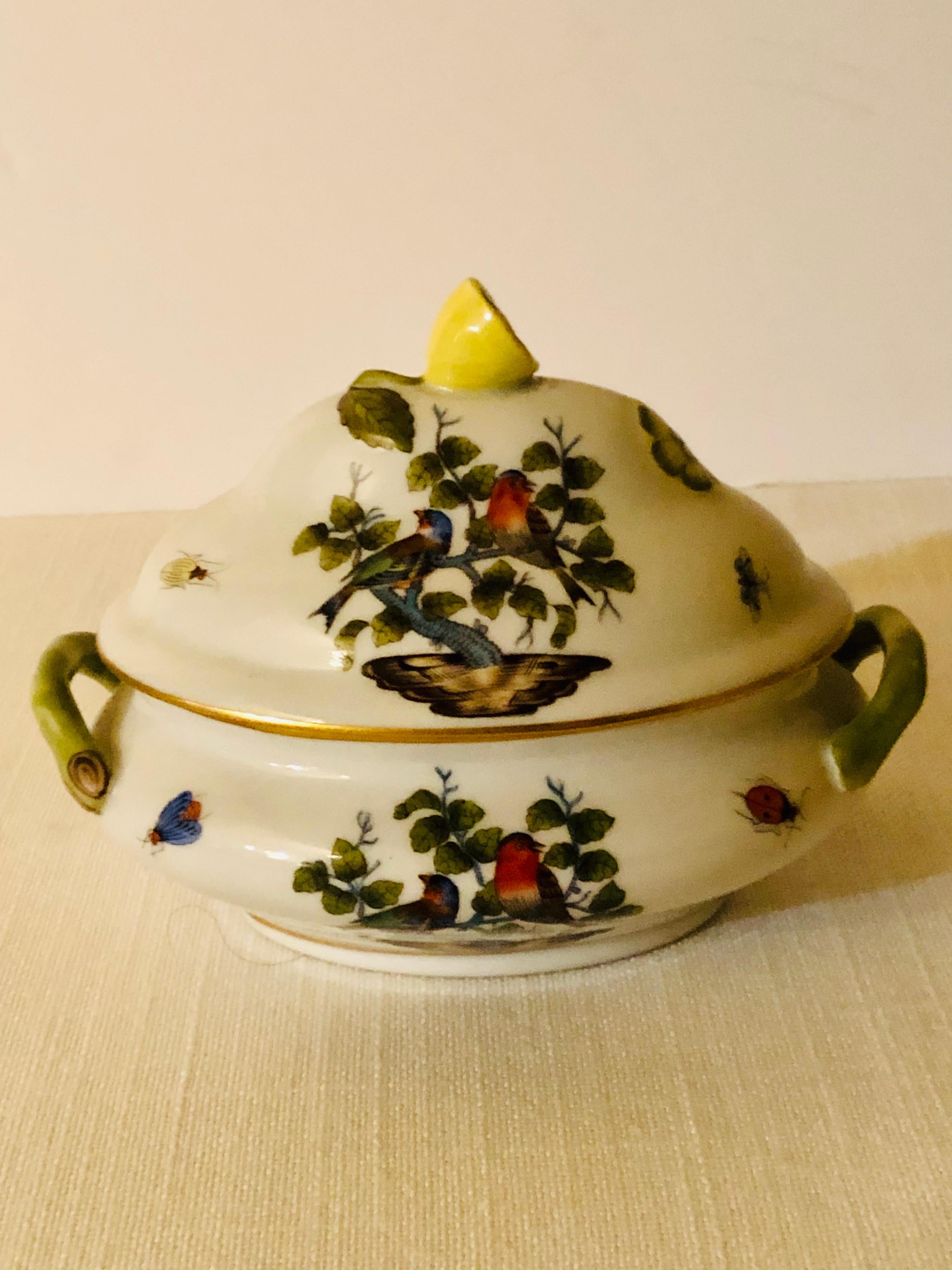 Wonderful antique Rothschild Bird Miniature Tureen painted with pairs of birds, butterflies and insects. The cover of this miniature antique Herend tureen has a raised lemon on top. It is from 1915-1930. It would be a wonderful addition to any