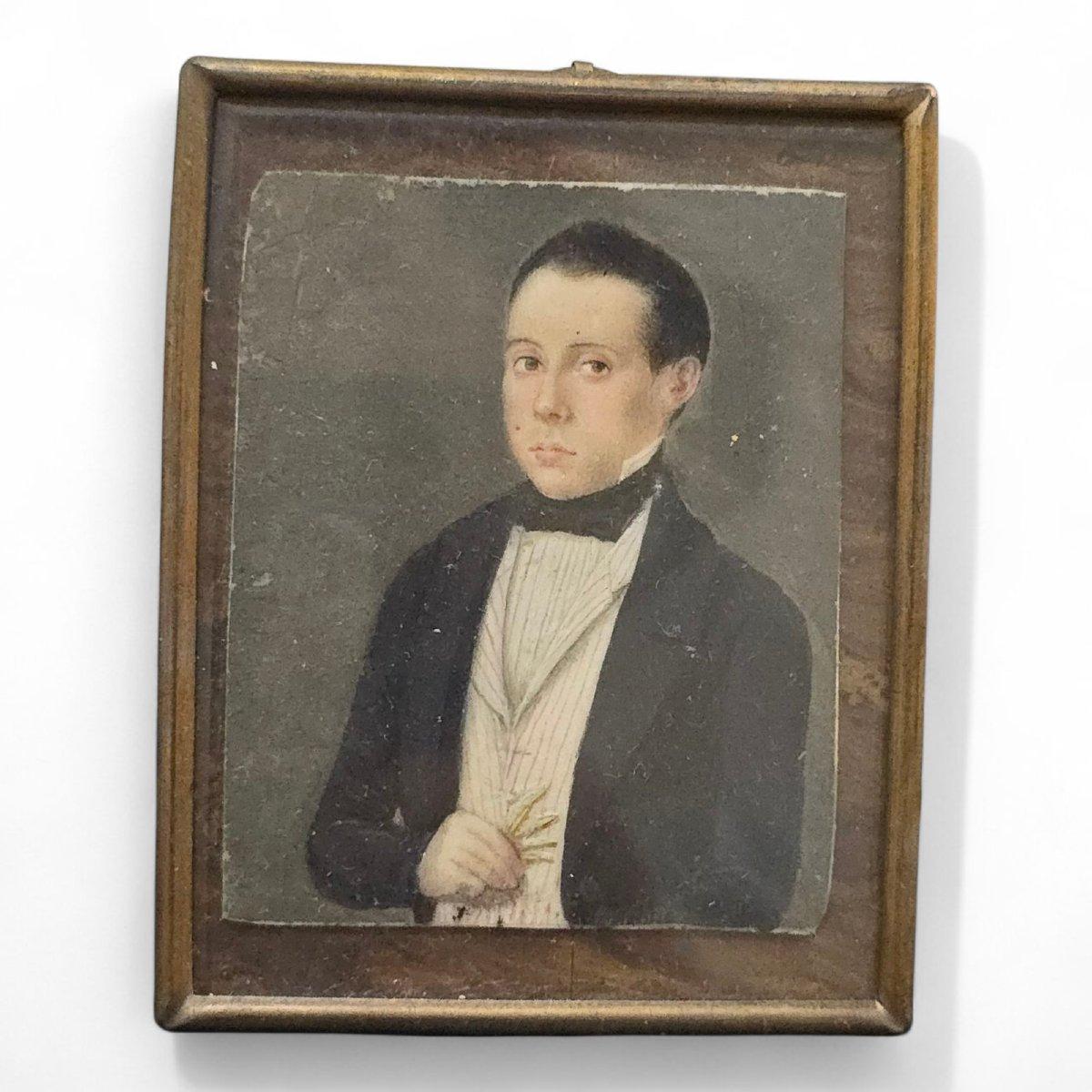 An elegant hand-painted miniature depicting the portrait of a 19th-century Spanish gentleman, dressed in the characteristic attire of the period. The subject appears distinguished, perhaps belonging to the nobility or upper middle class, and the