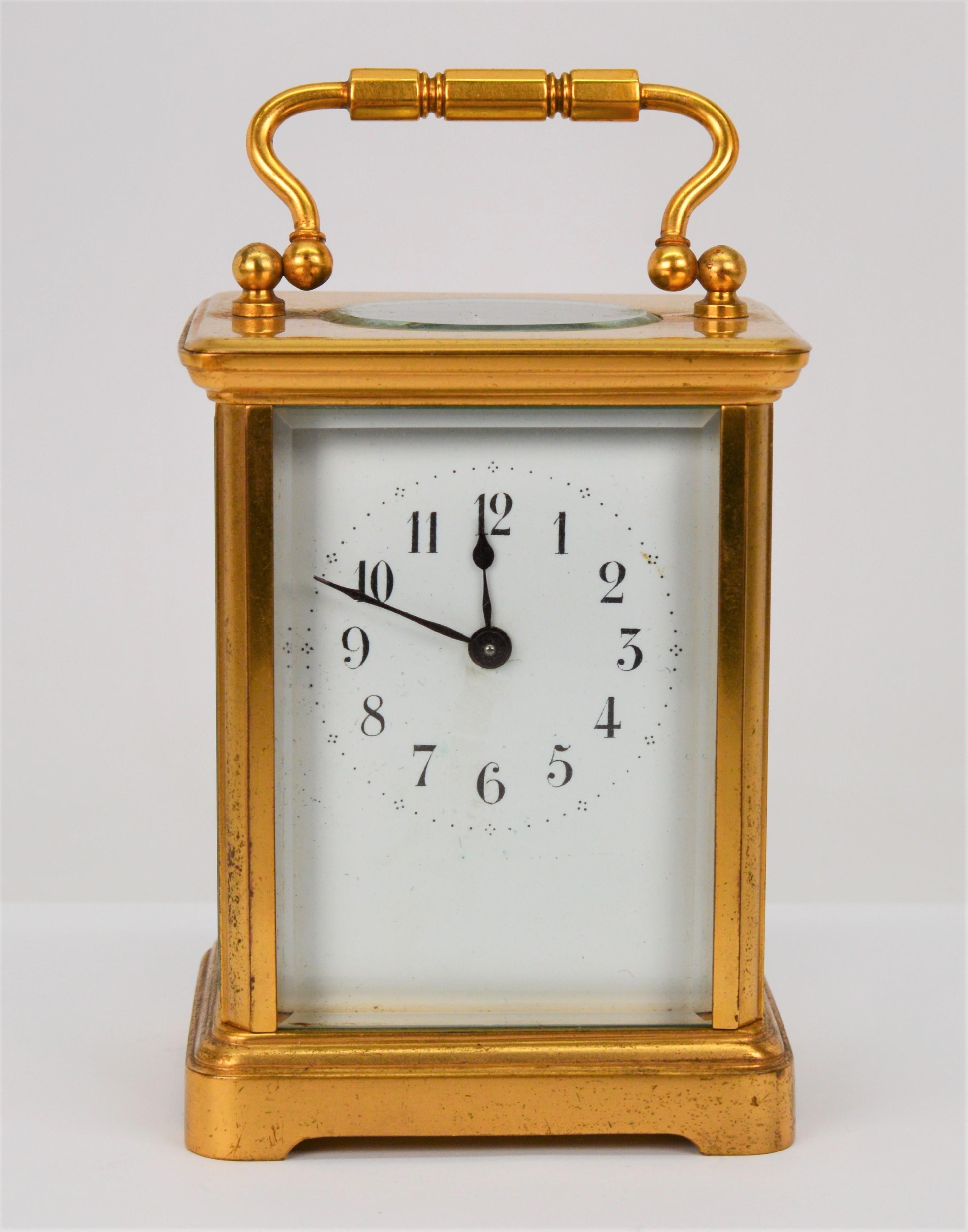 Imported from France by well known New York City importer Charles Jacque (1855-1950), this miniature carriage clock, height 4-1/2 inches x width 3-1/8 inches, is marked CJCC by the importer.
The clock case is made of brass and has beveled glass on