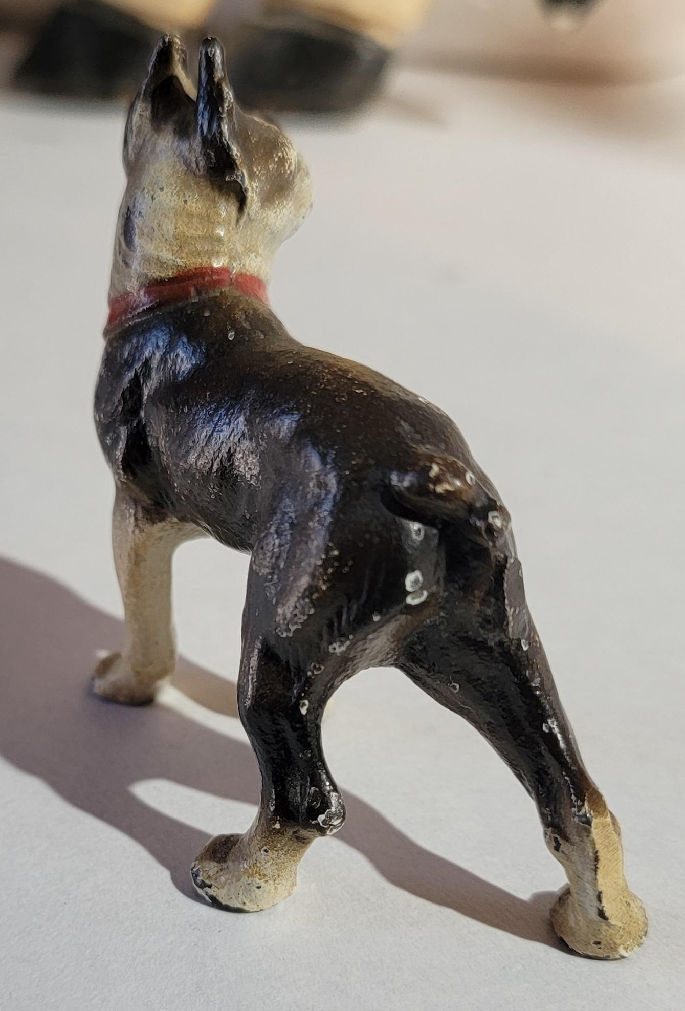 This fun miniature cast iron Boston Terrier is in original paint and in fine condition.Very rare to find these miniatures.