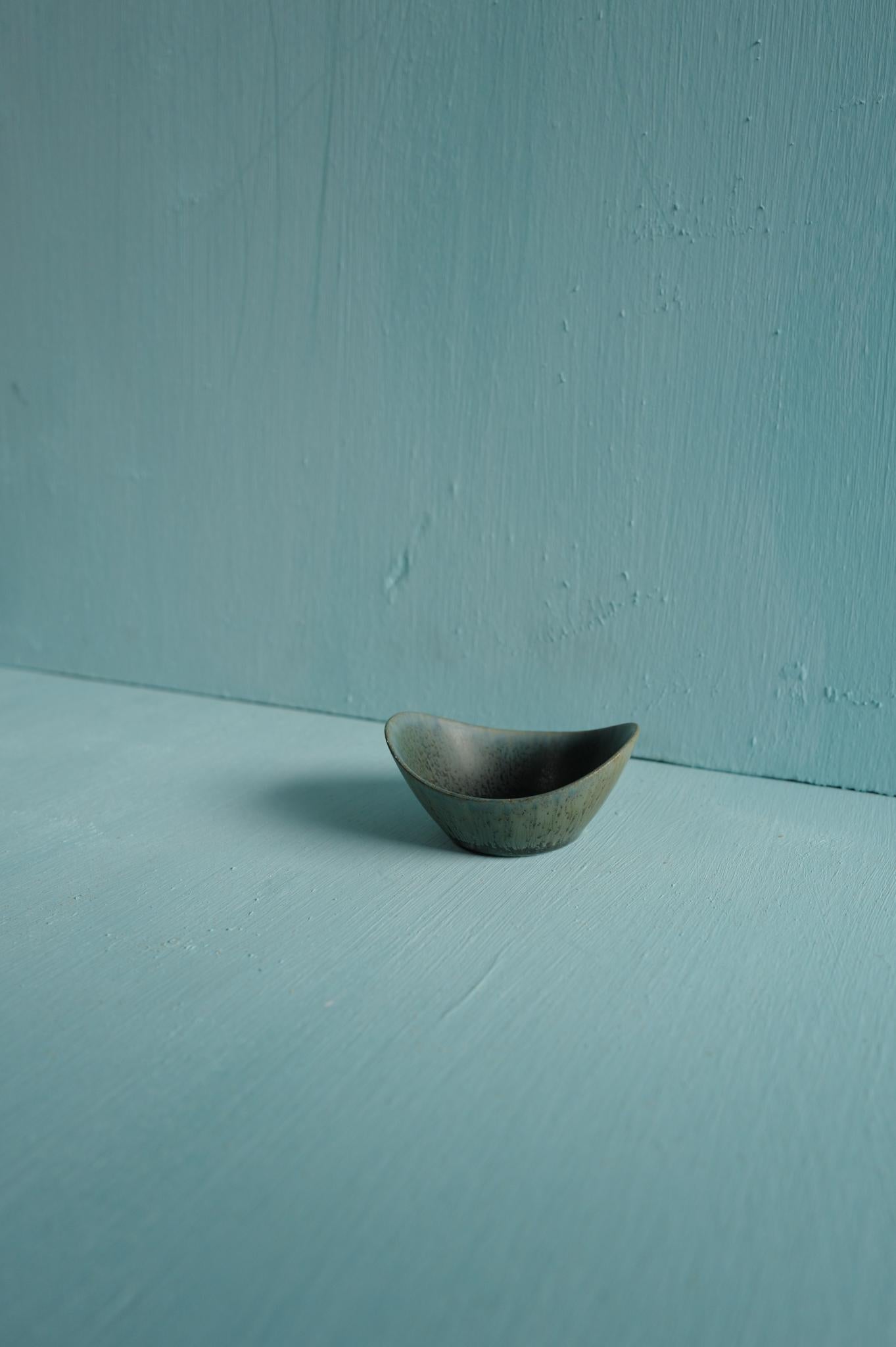 A miniature light blue speckled ceramic bowl designed by Carl-Harry Stålhane and produced by Rörstrand, Sweden, 1950s.

Carl-Harry Stålhane joined Rörstrand in 1939, beginning as a decorator under Gunnar Nylund before becoming one of Sweden’s most