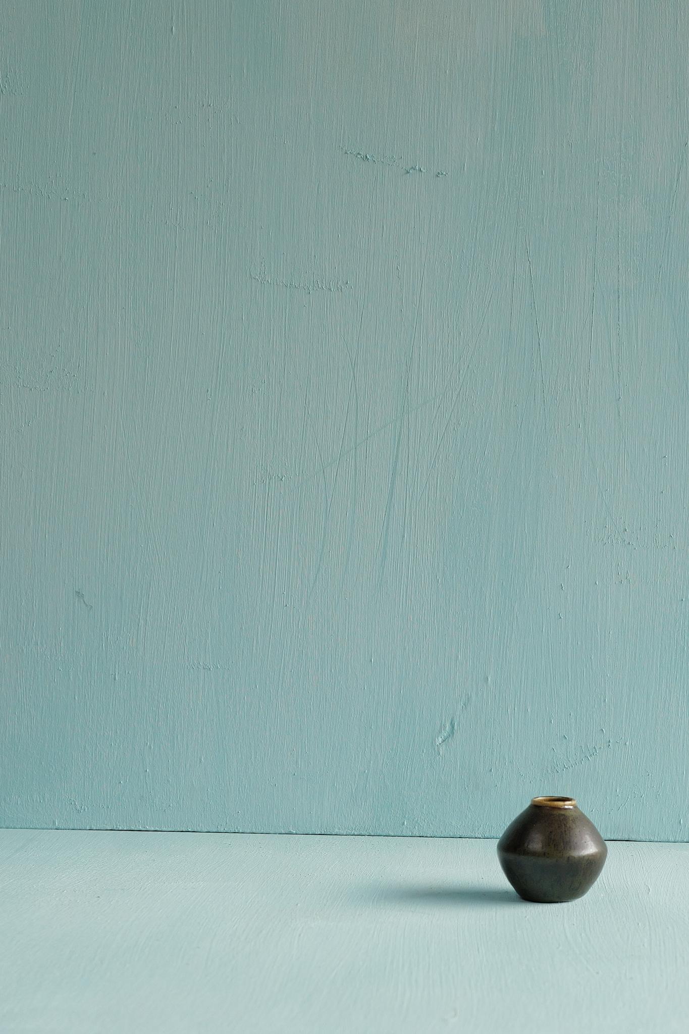 A miniature light blue speckled ceramic bowl designed by Berndt Friberg, produced by Gustavsberg, Sweden 1950s.

Berndt Friberg began working at Gustavsberg in 1934, mastering both form and glaze under legends like Wilhelm Kåge and Stig Lindberg.