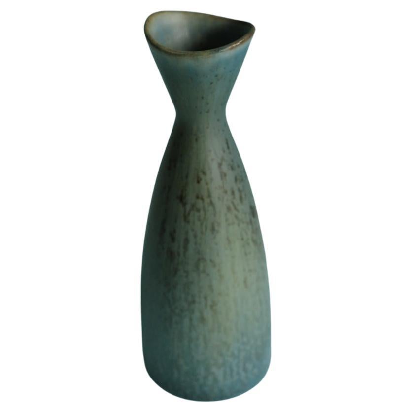 A miniature light blue speckled ceramic vase designed by Carl-Harry Stålhane and produced by Rörstrand, Sweden, 1950s.

Carl-Harry Stålhane joined Rörstrand in 1939, beginning as a decorator under Gunnar Nylund before becoming one of Sweden’s most