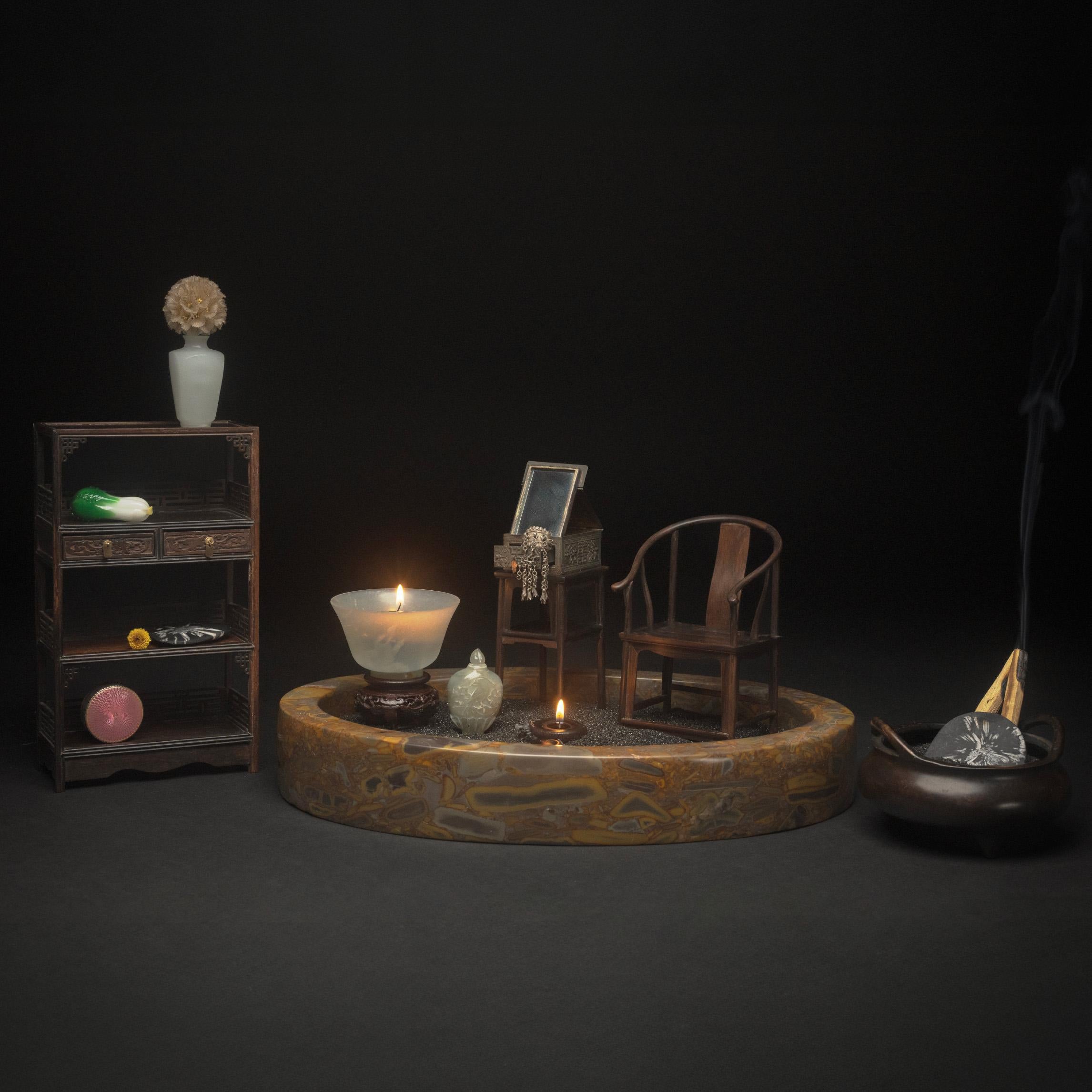 This miniature furniture set - at only 6 inches tall - beautifully recreates classic Chinese furniture forms down to the finest of details. Crafted of a beautiful hardwood, prized for its strength and dark color, the set includes a side table and