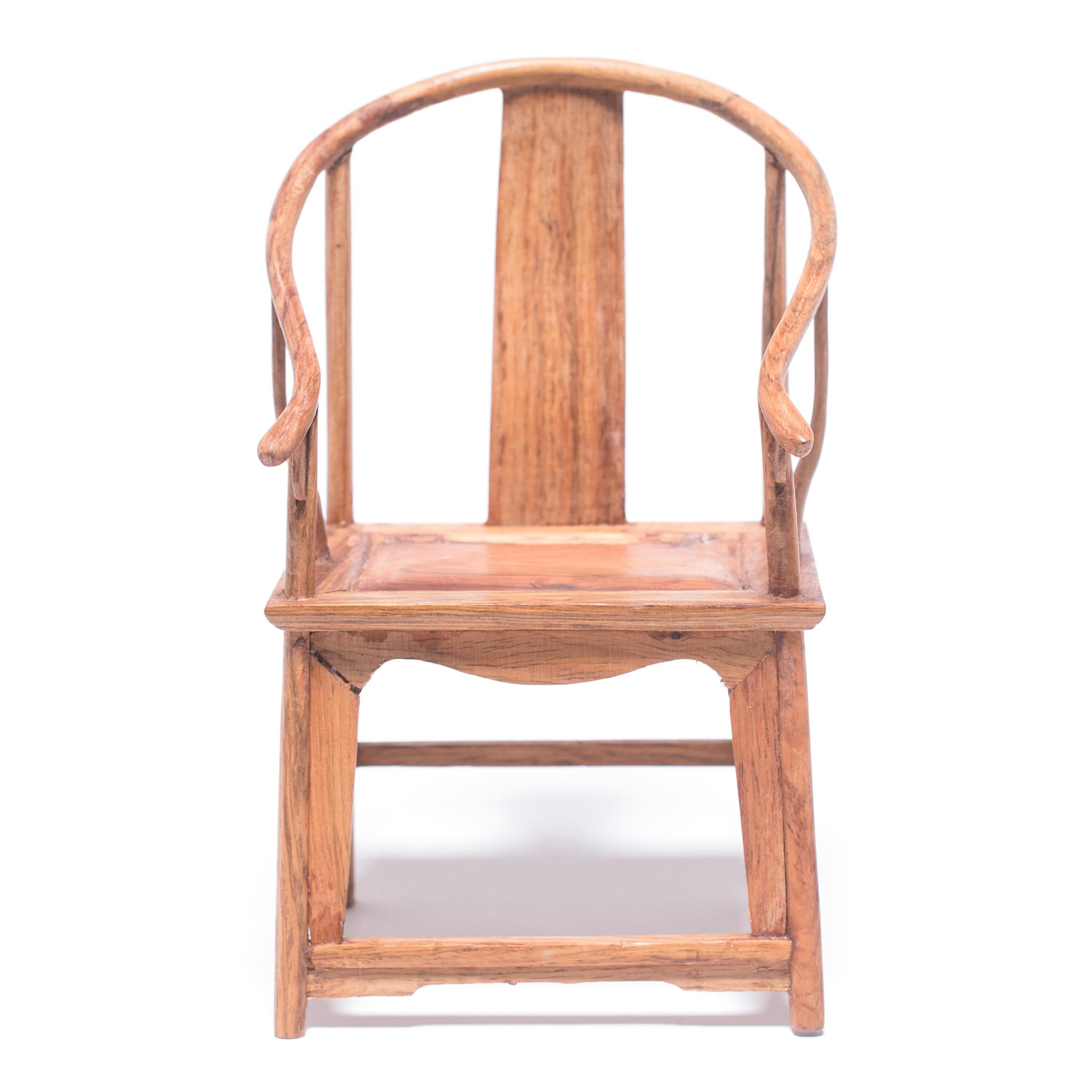 A full size set of chairs and table crafted with this level of workmanship would be an incredible find, but this beautiful furniture set—at only six inches tall—is perfectly constructed down to the tiniest minutia. The set was made in northern China