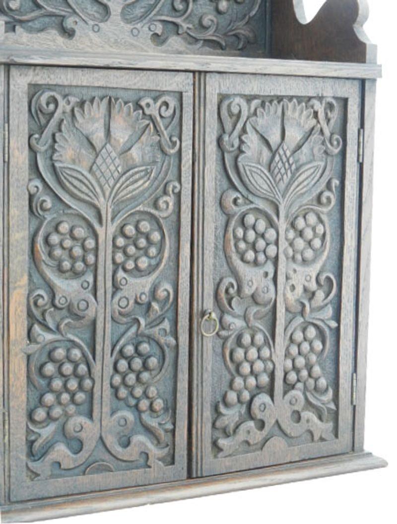 Miniature cupboard carved doors kitchen storage spices c1910.
Great cupboard for Spices etc.
Charming addition to your Kitchen.
Very good condition with minor age and use.
 