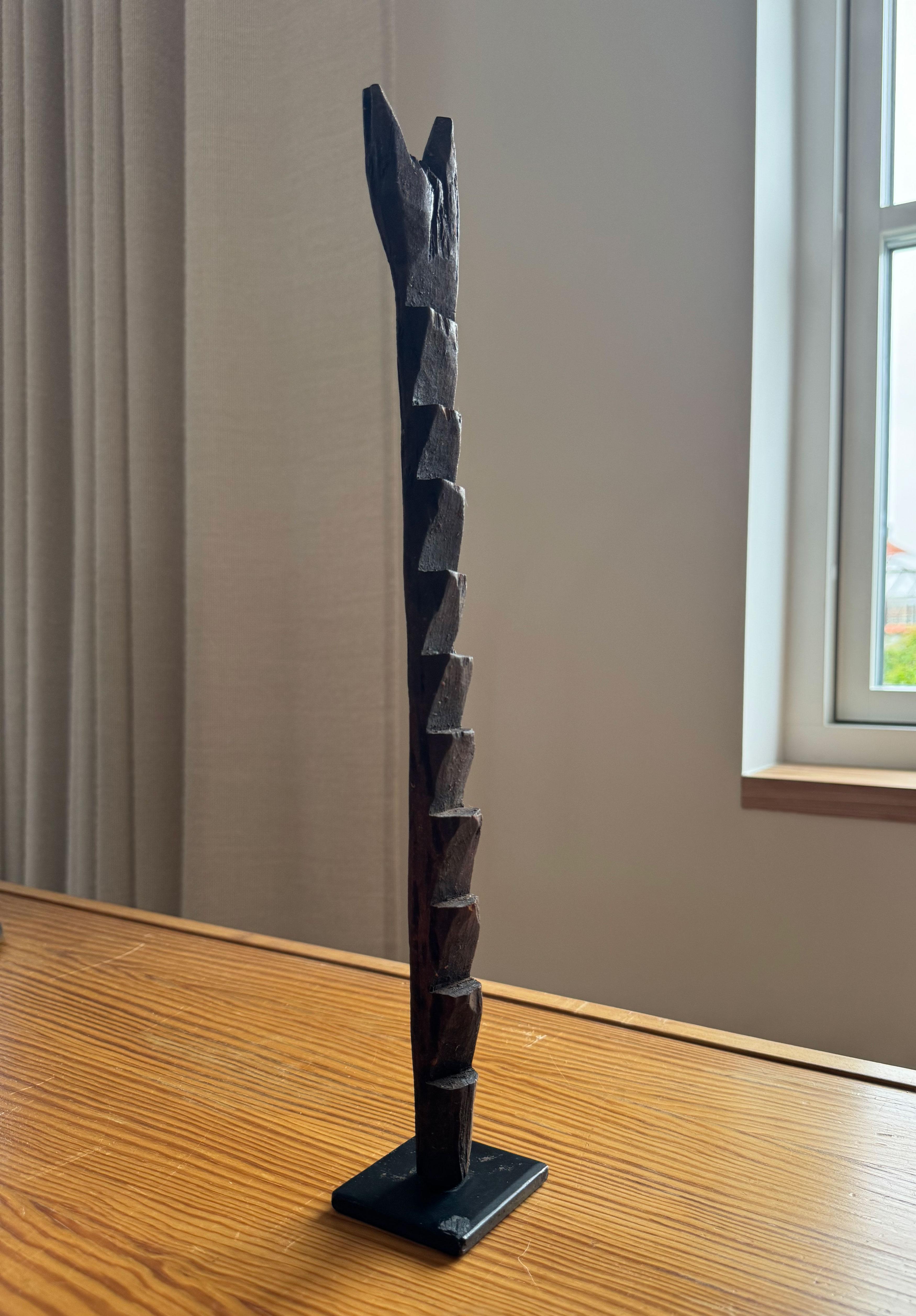 Symbolically, miniature ladders like the Dogon ladder can hold various meanings depending on the context in which they are used and their cultural or historical background. For example, a miniature ladder can be a metaphor for ambition and personal