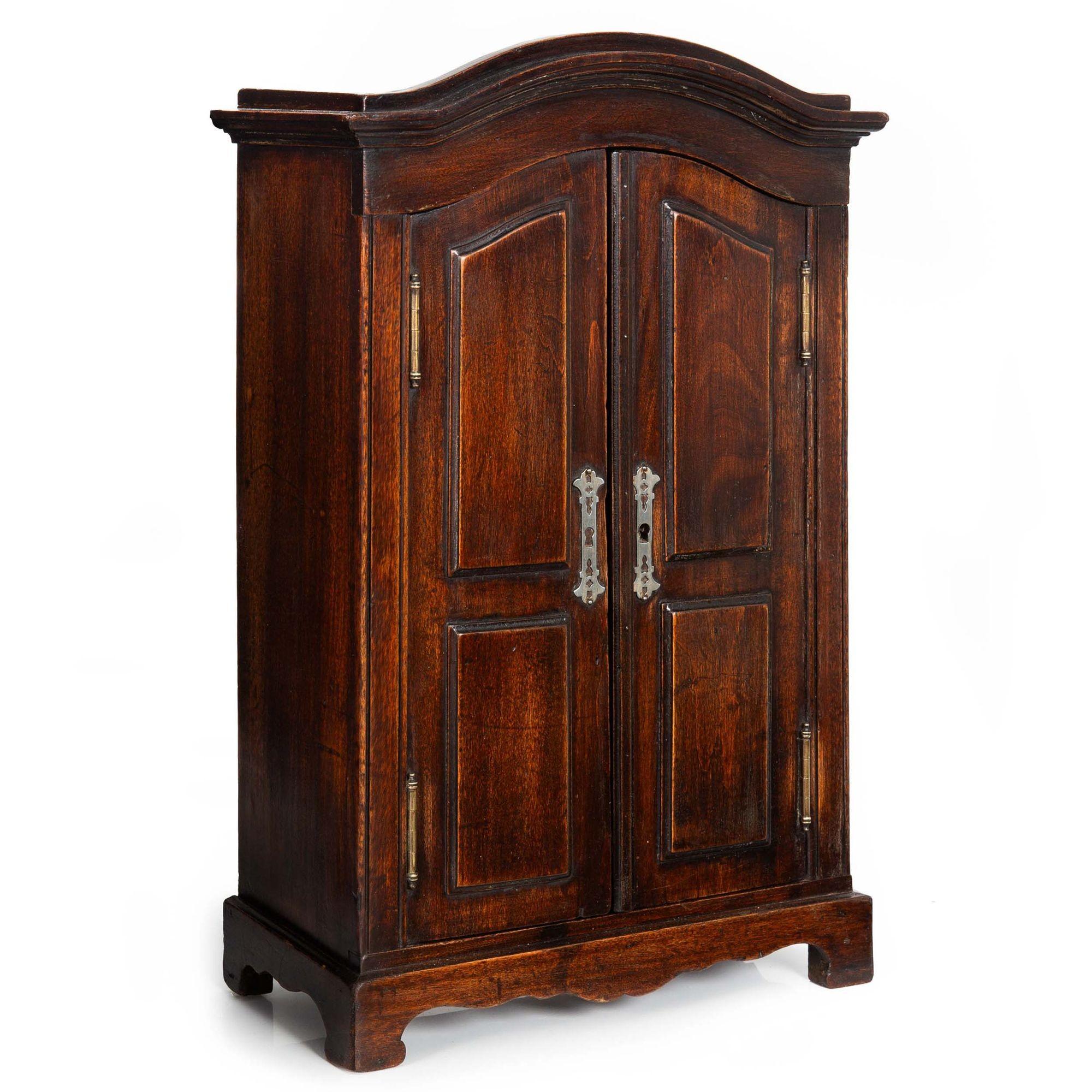 MINIATURE DOLL-SIZE STAINED FRUITWOOD ARMOIRE
Probably French, circa 1880-1910
Item # 403FPM02P

A very well-made doll-size miniature armoire from the turn of the century, the armoire features an arched crown with a stepped molding over a pair of