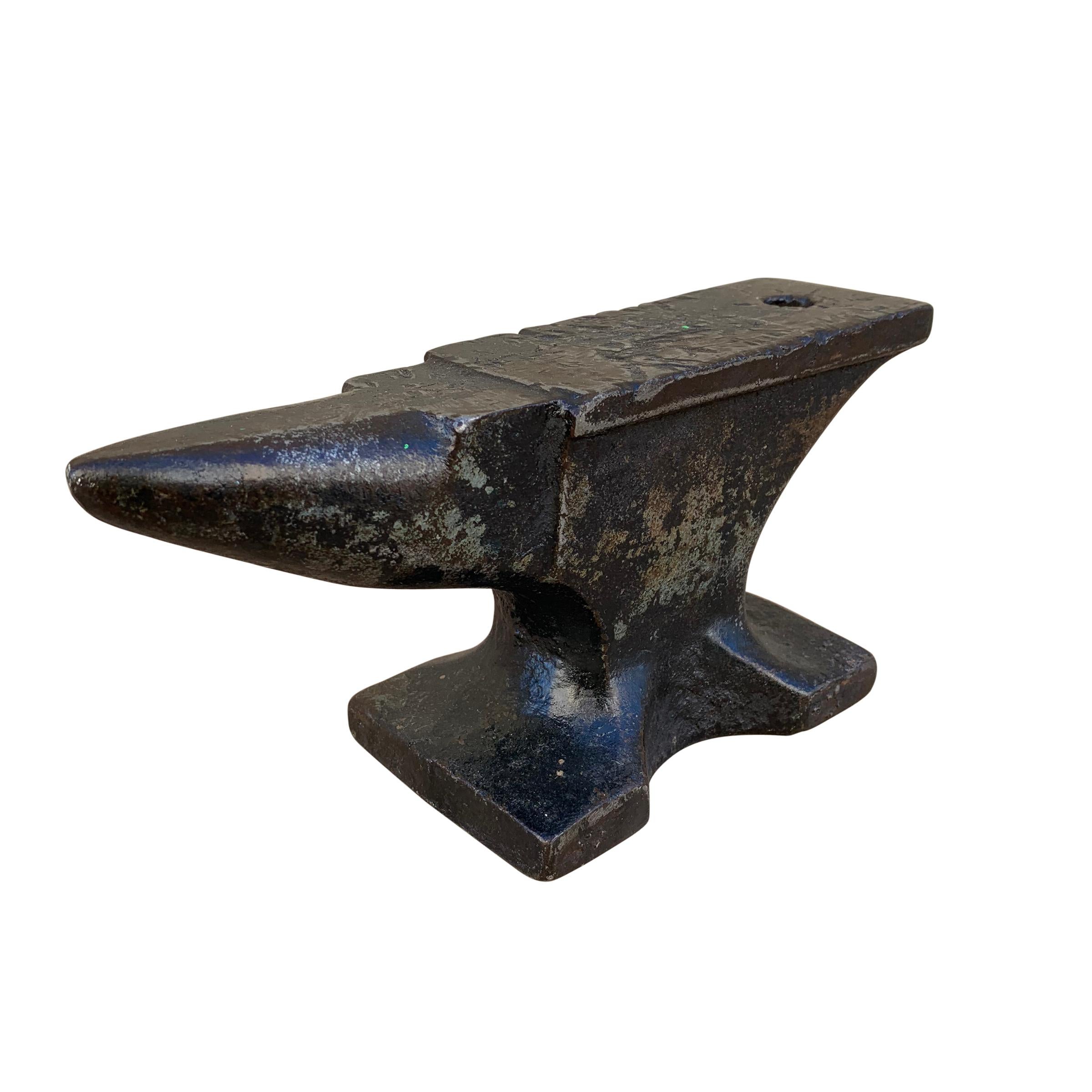 A wonderful miniature early 20th century American iron bench anvil with a beautiful patina, and signs of decades of use. Makes a great sculpture or paperweight.