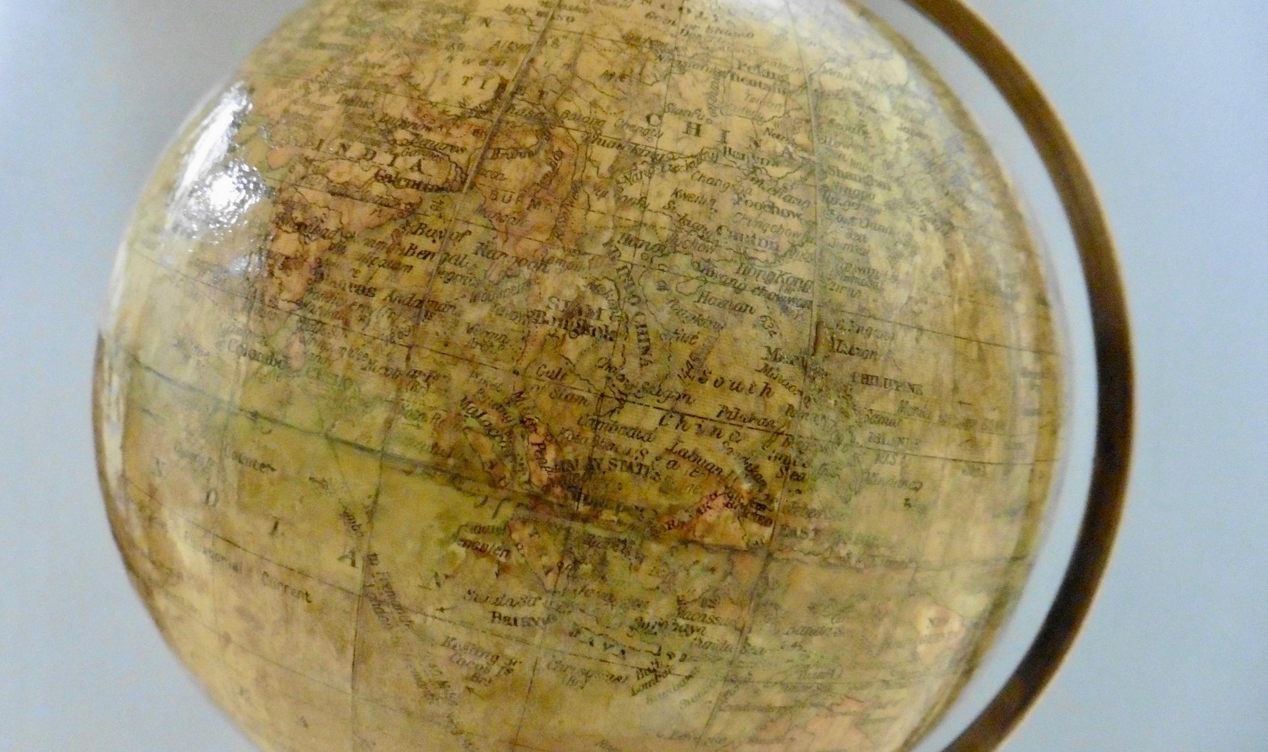 Fine Miniature Terrestrial Geographia 6 inch table globe standing on an ebonised circular base with half meridian surmounted by a turned finial.

The globe is complete with it’s original colored paper gores and maintains a good colour with little