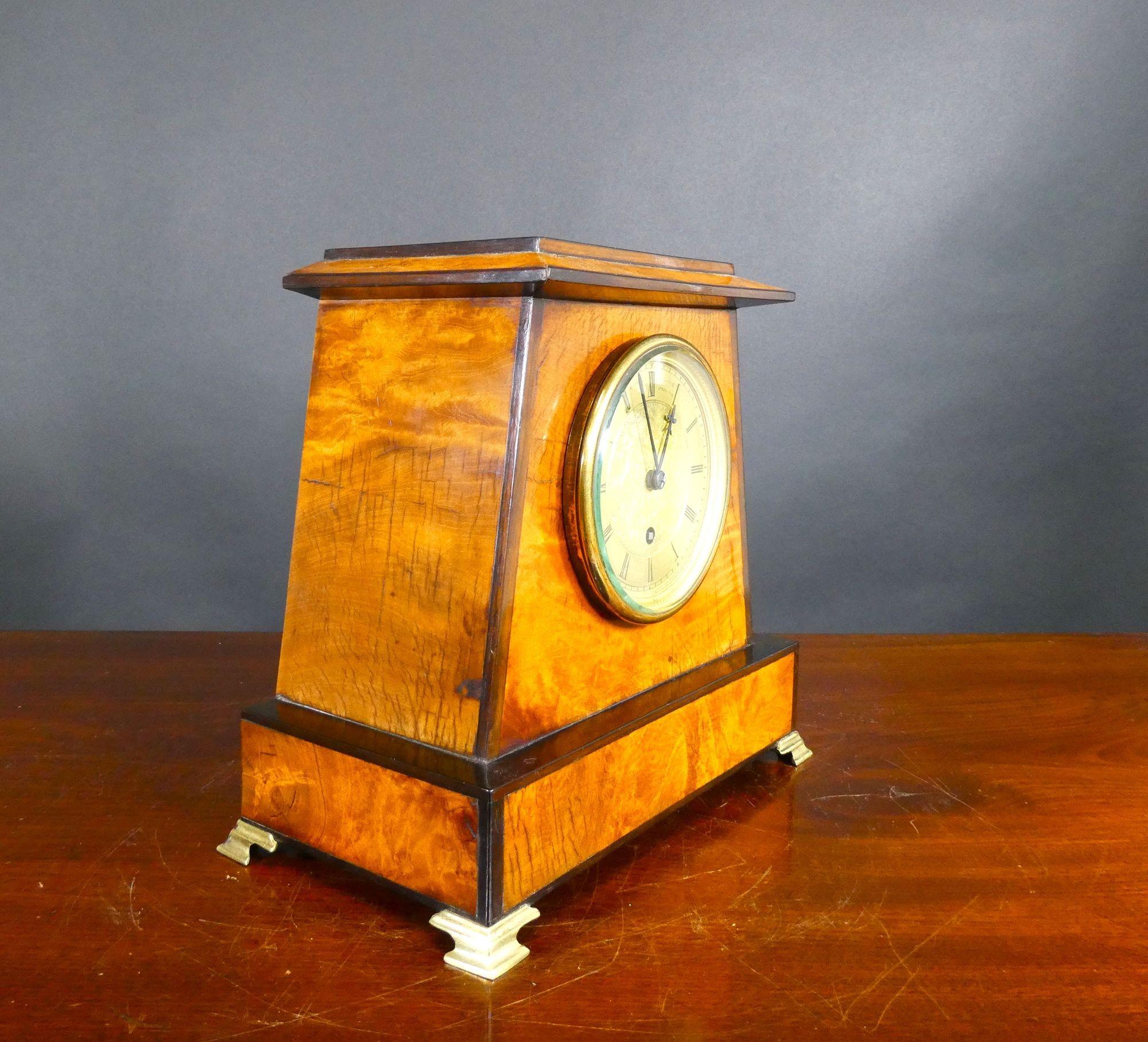 Miniature Egyptian Style Walnut Bracket Clock, Barraud & Lund, London

Rare miniature English fusee bracket clock housed in an Egyptian style walnut case with ebony mouldings, stepped top and resting on four brass bracket feet.

Gilded and chased