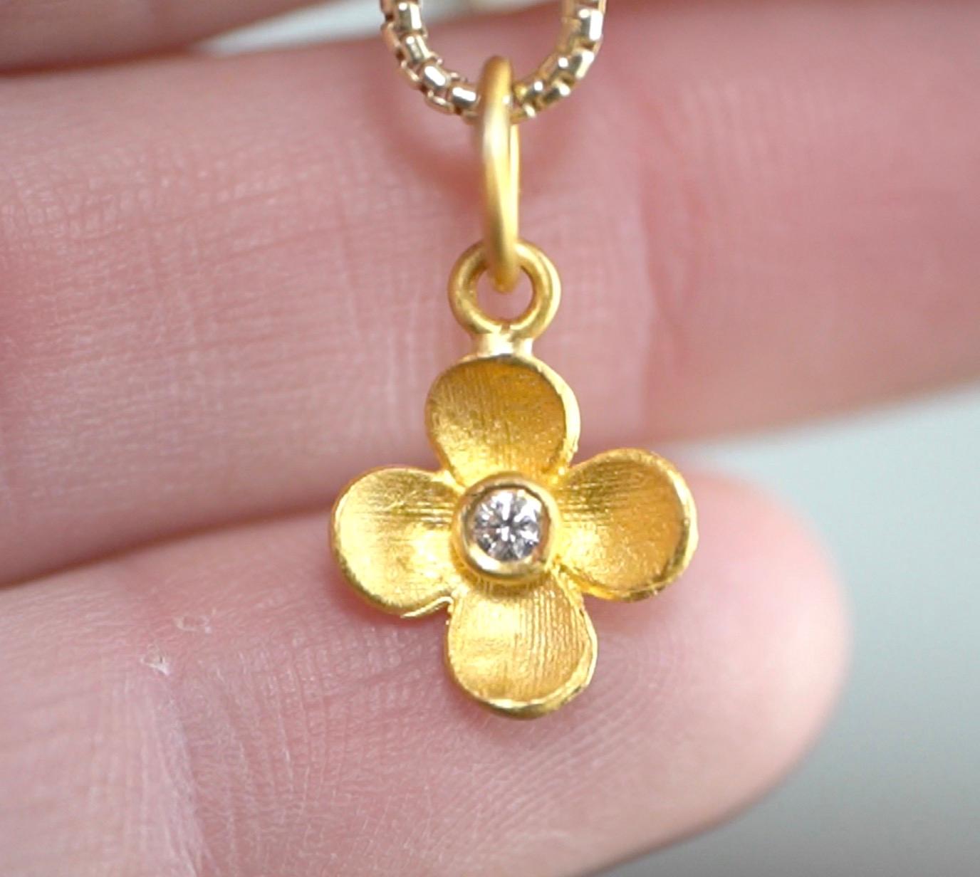 Miniature Four-Petal Flower Charm Pendant Necklace with Center Diamond, 24kt Solid Gold by Prehistoric Works of Istanbul, Turkey. These pendants pair well alone or with other pendants or with other miniature pendants. Great for layering. Comes with